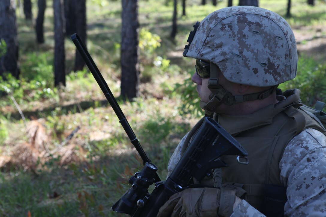 Staff Sgt. Joshua Kosma, platoon sergeant with Company K, Battalion Landing Team 3/8, 26th Marine Expeditionary Unit, moves through the woods to the objective as part of a simulated raid at Combat Town during the Motorized Raid Course aboard Camp Lejeune, N.C., April 28, 2010. The Motorized Raid Course is one of several Special Operations Training Group, II Marine Expeditionary Force, events as part of 26th MEU's preparation for deployment this fall. ::r::::n::