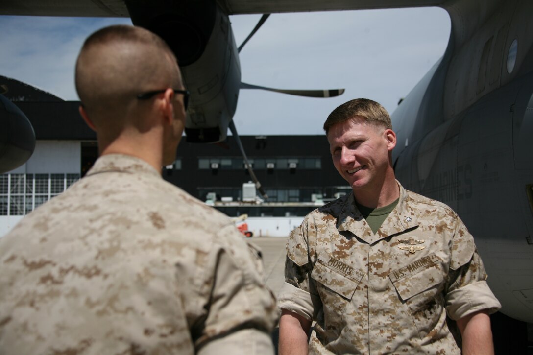 Lt. Col. David C. Morris, Marine Aerial Refueler Transport Squadron 252’s commanding officer, speaks with Cpl. Brandon N. Gillotti, a loadmaster with VMGR-252, and congratulates him, April 28, for winning the meritorious sergeant board for Marine Aircraft Group 14.