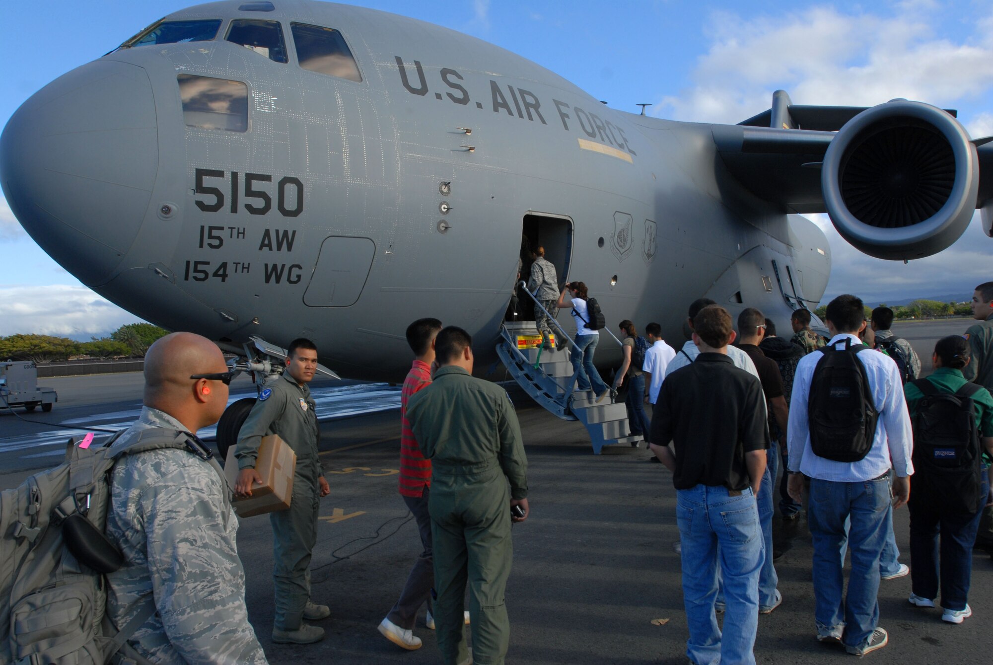 JOINT BASE PEARL HARBOR HICKAM, Hawaii - Army Reserves Officers' Training Corps and Air Force Reserves Officers' Training Corps cadets from the University of Hawaii Detachment 175th, board onto a C-17 Globemaster III during an incentive flight here, April 28. The annual incentive flight exposes cadets to active duty positions and allows them to get a first hand look at the pilot programs and other types of air force specialty codes. (U.S. Air Force photo/Senior Airman Gustavo Gonzalez)