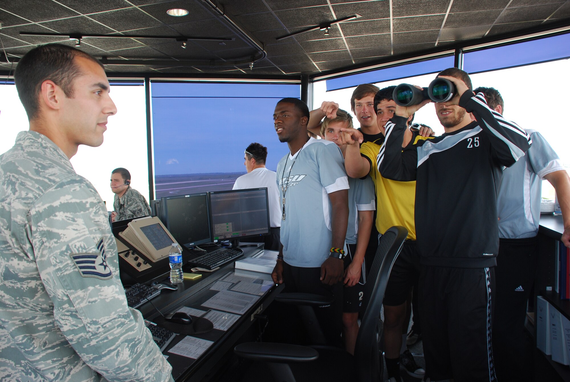 Control Tower Watch Supervisor Staff Sgt. William Vargas briefs several members of the Midwestern State University Soccer Team during a tour of the Control Tower and Radar Approach Control April 28, 2010.  Twenty MSU personnel visited the 80th Flying Training Wing before conducting the fifth annual Soccer Youth Clinic for Sheppard children.  (U.S. Air Force photo/Debi Smith)