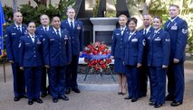Pacific Air Forces outstanding Airmen of the year pose for a group photo after a wreath-laying ceremony at the Courtyard of Heroes, Headquarters Pacific Air Forces, Joint Base Pearl Harbor Hickam, Hawaii, April 26, 2010.  The group presided over the ceremony honoring those who died at Hickam Air Field, Dec. 7, 1941.  (U.S.  Air Force photo/Tech. Sgt. Jerome S. Tayborn)