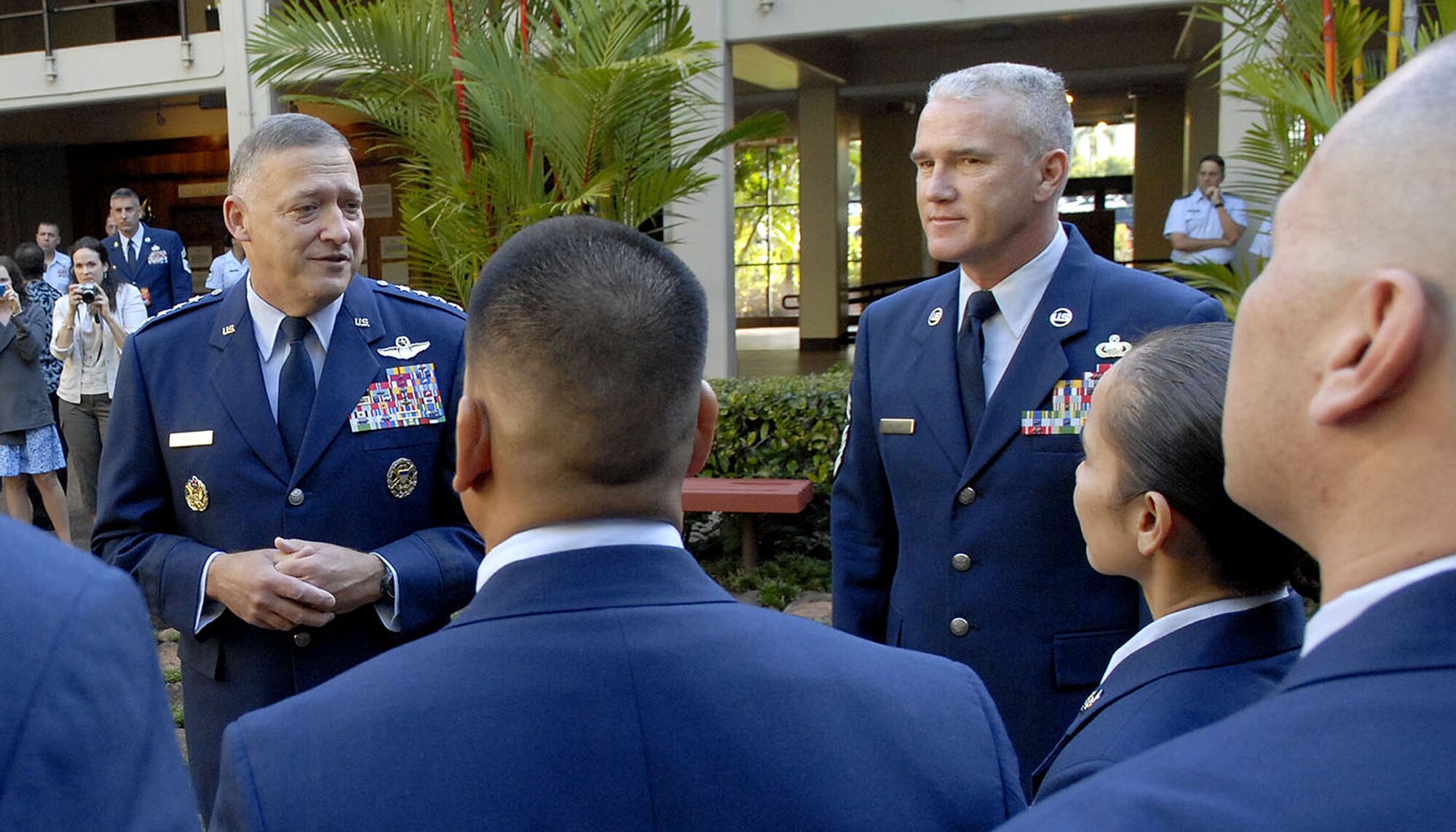 Gen. Gary North, Pacific Air Forces commander, and PACAF, Command Chief Master Sergeant Brooke McLean, welcome PACAF?s outstanding Airmen to Joint Base Pearl Harbor Hickam, Hawaii, April 26, 2010, after a wreath laying ceremony at the Courtyard of Heroes, Headquarters Pacific Air Forces, The group presided over the ceremony honoring those who died at Hickam Air Field, Dec. 7, 1941.  (U.S.  Air Force photo/Tech. Sgt. Jerome S. Tayborn)