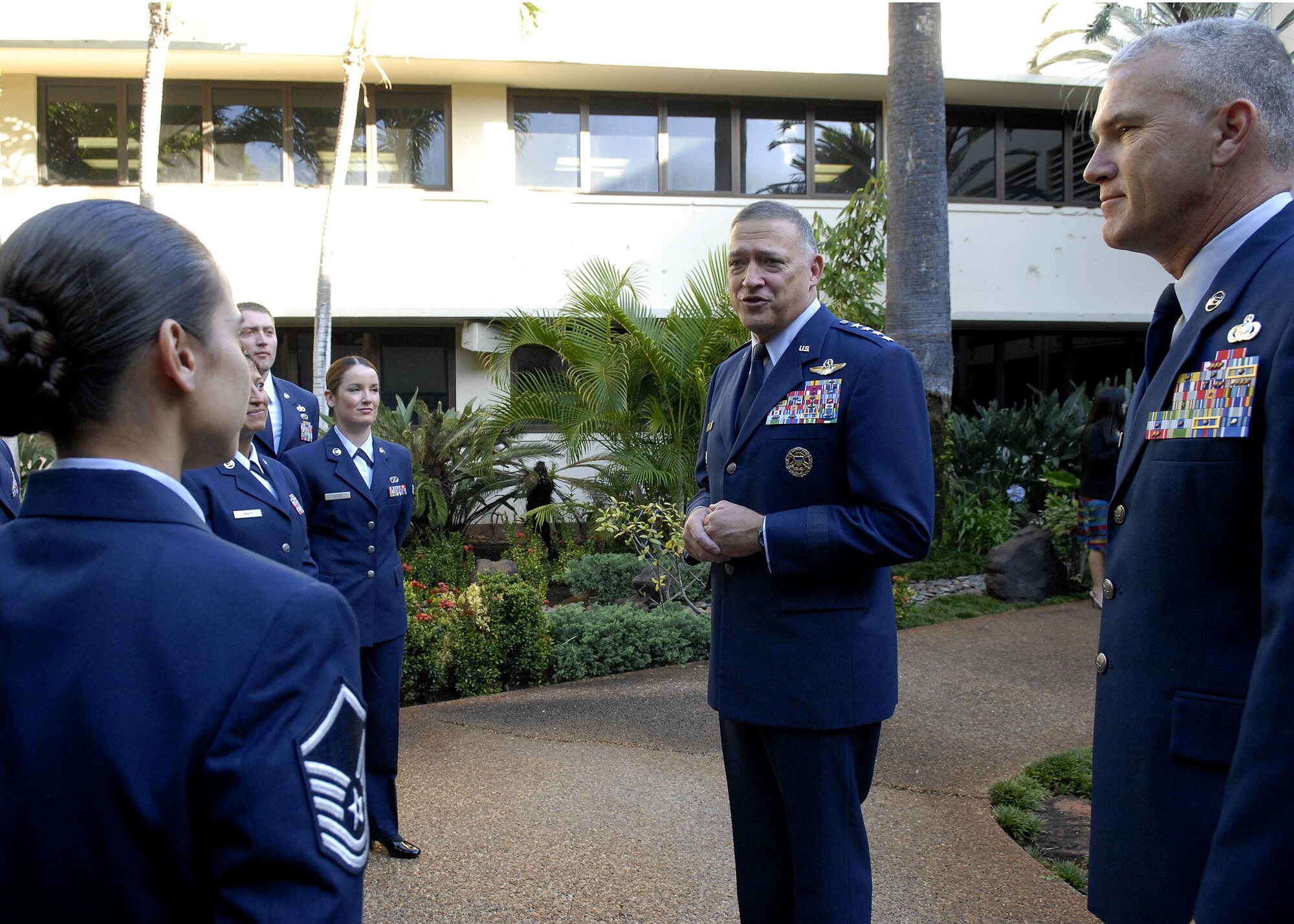 Gen. Gary North, Pacific Air Forces Commander, and Pacific Air Forces, Command Chief Master Sergeant Brooke McLean, welcomes PACAF?s outstanding Airmen to Joint Base Pearl Harbor Hickam, Hawaii, April 26, 2010, after a wreath laying ceremony at the Courtyard of Heroes, Headquarters Pacific Air Forces, The group presided over the ceremony honoring those who died at Hickam Air Field, Dec. 7, 1941.  (U.S.  Air Force photo/Tech. Sgt. Jerome S. Tayborn)