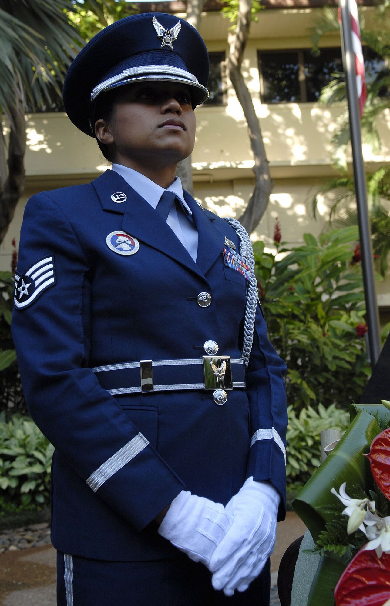 Staff Sgt. Renee Torres, from the Joint Base Pearl Harbor Hickam Honor Guard, stands post during a wreath-laying ceremony at the Courtyard of Heroes, Headquarters Pacific Air Forces, Hawaii, April 26, 2010. Gen. Gary North, Pacific Air Forces commander, PACAF, Command Chief Master Sergeant Brooke McLean, and PACAF?s outstanding Airmen of the year presided over the ceremony honoring those who died at Hickam Air Field, Dec. 7, 1941. (U.S. Air Force photo/Tech. Sgt. Jerome S. Tayborn) 