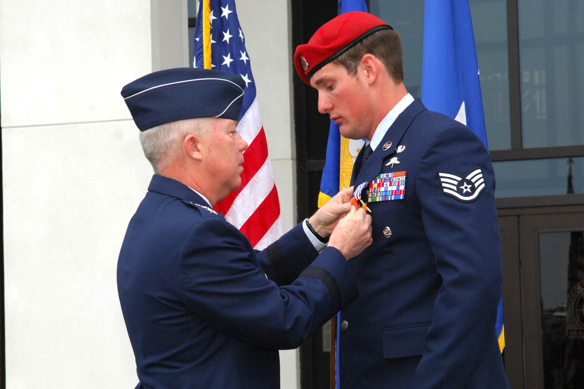 Lt. Gen. Donald Wurster, commander of Air Force Special Operations Command,
presents the Silver Star to Staff Sgt. Caleb Heidelberg, 21st Special
Tactics Squadron, during a Silver Star Ceremony April 23 at the Combat
Control School on Pope Air Force Base. General Wurster also presented four
Bronze Star Medals with Valor, four Bronze Stars, three Purple Hearts and
seven Air Force Combat Action Medals to special tactics Airmen for actions
during their deployments. (U.S. Air Force Photo/Buck Buchanan)
