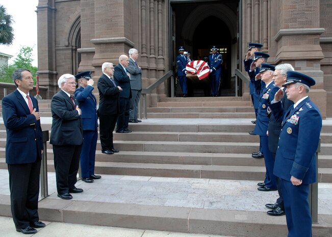 Honorary pallbearers salute U.S. Air Force Brig. Gen. Thomas R. Mikolajcik as members from Joint Base Charleston Honor Guard march down the steps of the church for the funeral April 24, 2010, at the Cathedral of St. John the Baptist in Charleston, S.C. General Mikolajcik passed away April 17, 2010 at the age of 63 after battling amyotrophic lateral sclerosis, commonly referred to as Lou Gehrig's disease. (U.S. Air Force photo/Senior Airman Timothy Taylor)
