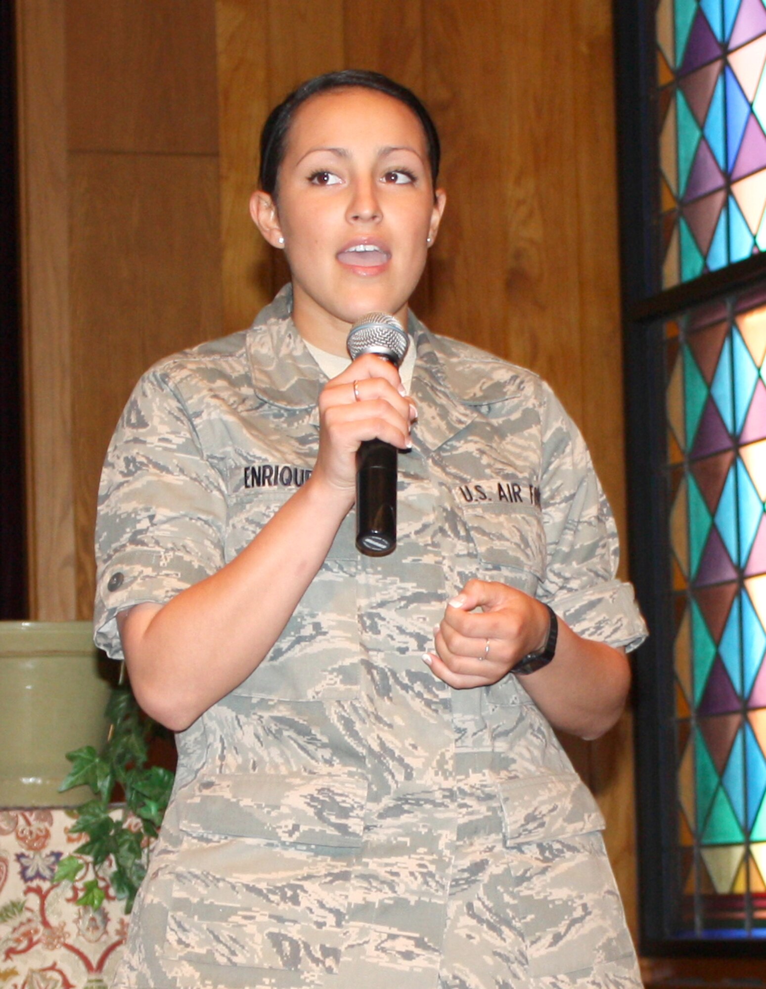 Airman Basic Shalamar Enriquez, a student from the 336th Training Squadron, was selected to sing the National Anthem during the National Prayer Event April 22 at Triangle Chapel.  The service focused on prayers for the nation.  Chief Master Sgt. Lonnie Slater, 81st Training Wing command chief, spoke on the military and the importance of the freedom of religion.  Sixteen students sang, played instruments and read prayers and poetry.  Chaplain (Capt.) Kenya Thomas, project leader, said about 85 people attended. The 81st Training Group chaplains and nonprior service students sponsored the event and members of the parish supplied desserts.  (U.S. Air Force photo by Airman John Kenyon)
