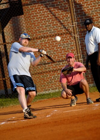 Mr. James Knoll hits a pop fly to left field to end the 4th inning at the softball field April 23, 2010, on Joint Base Charleston, S.C. Boeing defeated the 701st Airlift Squadron 10-9. Mr. Knoll is a technical representative for Pratt & Whitney. (U.S. Air Force photo/Senior Airman Timothy Taylor)