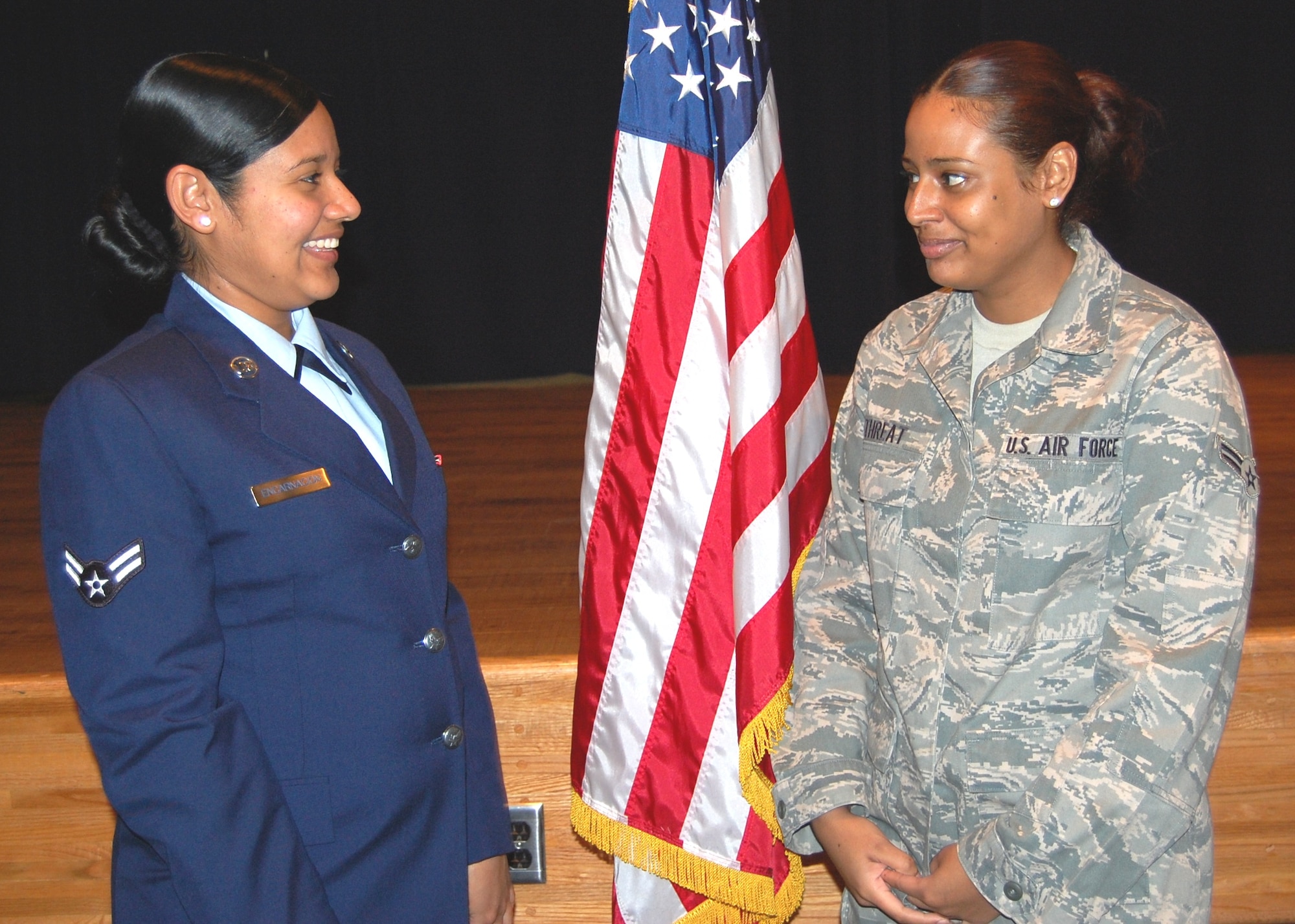 Sisters Airmen 1st Class Zenita Encarnacion, 19, left, and Nisha Threat, 21, spend a moment together before Airman Encarnacion’s recent diagnostic imaging Phase II course graduation.   They enlisted together Sept. 23, 2008, and went through basic training at Lackland Air Force Base, Texas, in the same flight.  After completing basic training, Airman Encarnacion attended Phase I training at Sheppard AFB, Texas.  Airman Threat completed technical training as a nutrition care specialist at Lackland  and Sheppard, arriving at Keesler in March 2009.  Her sister followed in June.  Airman Encarnacion joins her husband, Airman 1st Class Jacob Lindsey, also a diagnostic imaging technologist, at Lackland.  He graduated from the Keesler Phase II program in December.  Airman Threat is married to Airman 1st Class Lawrence Threat, a security forces member assigned to Ramstein AB, Germany.  The sisters are from St. Croix, U.S. Virgin Islands.  (U.S. Air Force photo by Steve Pivnick)