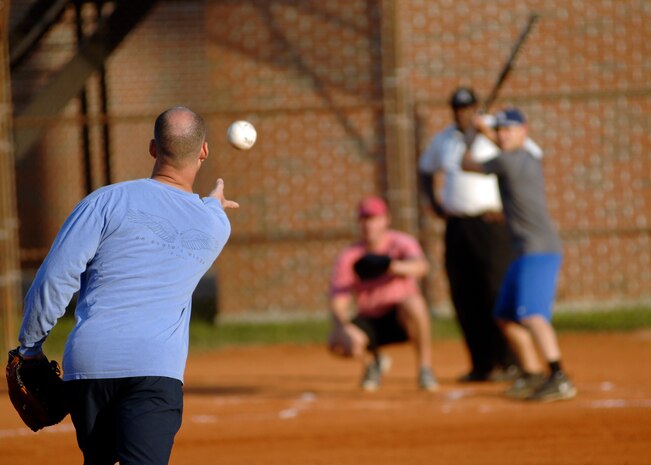 Tech. Sgt. Arrin Baker lobs a softball to a Boeing batter at the softball field April 23, 2010, at Joint Base Charleston, S.C. The game between the 701st Airlift Squadron and Boeing was one of the first softball games of the season to be held on Joint Base Charleston. Sergeant Baker is a loadmaster with the 300th Airlift Squadron. (U.S. Air Force photo/Senior Airman Timothy Taylor)