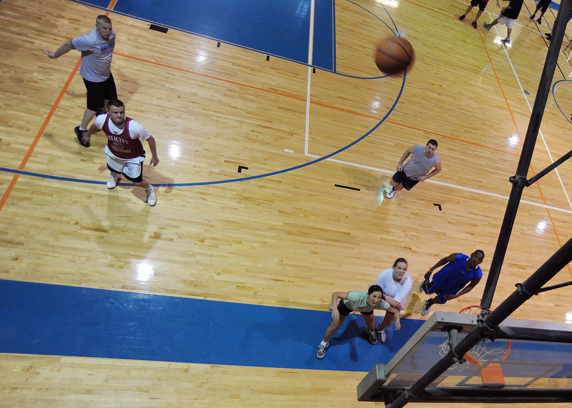 The 22nd Medical Group and the 22nd Civil Engineer Squadron compete in a 3-on-3 basketball tournament at the base’s main gymnasium April 22, 2010, McConnell Air Force Base, Kan. Warrior Day is designed to promote physical fitness and build unit esprit de corps. (U.S. Air Force photo/Senior Airman Maria Ruiz)