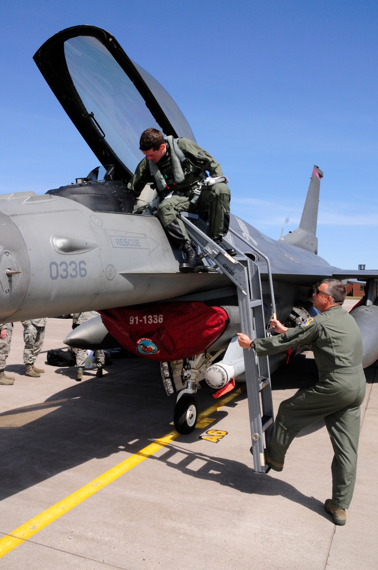 U.S. Air Force Colonel John Spencer, Jr., Vice Wing Commander, greats Maj. Matt Gynn as F-16C Block 50 Fighting Falcons from Spangdahlem Air Base, Germany arrive at the 148th Fighter Wing Air National Guard Base, Duluth, Minn. Apr. 27, 2010. The aircraft is one of the first block 50 F-16s to arrive at the wing as the unit becomes the first Air National Guard unit to convert to the block 50 aircraft from Active Duty Air Force.  (U.S. Air Force photo by Tech. Sgt. Brett R. Ewald/Released) 