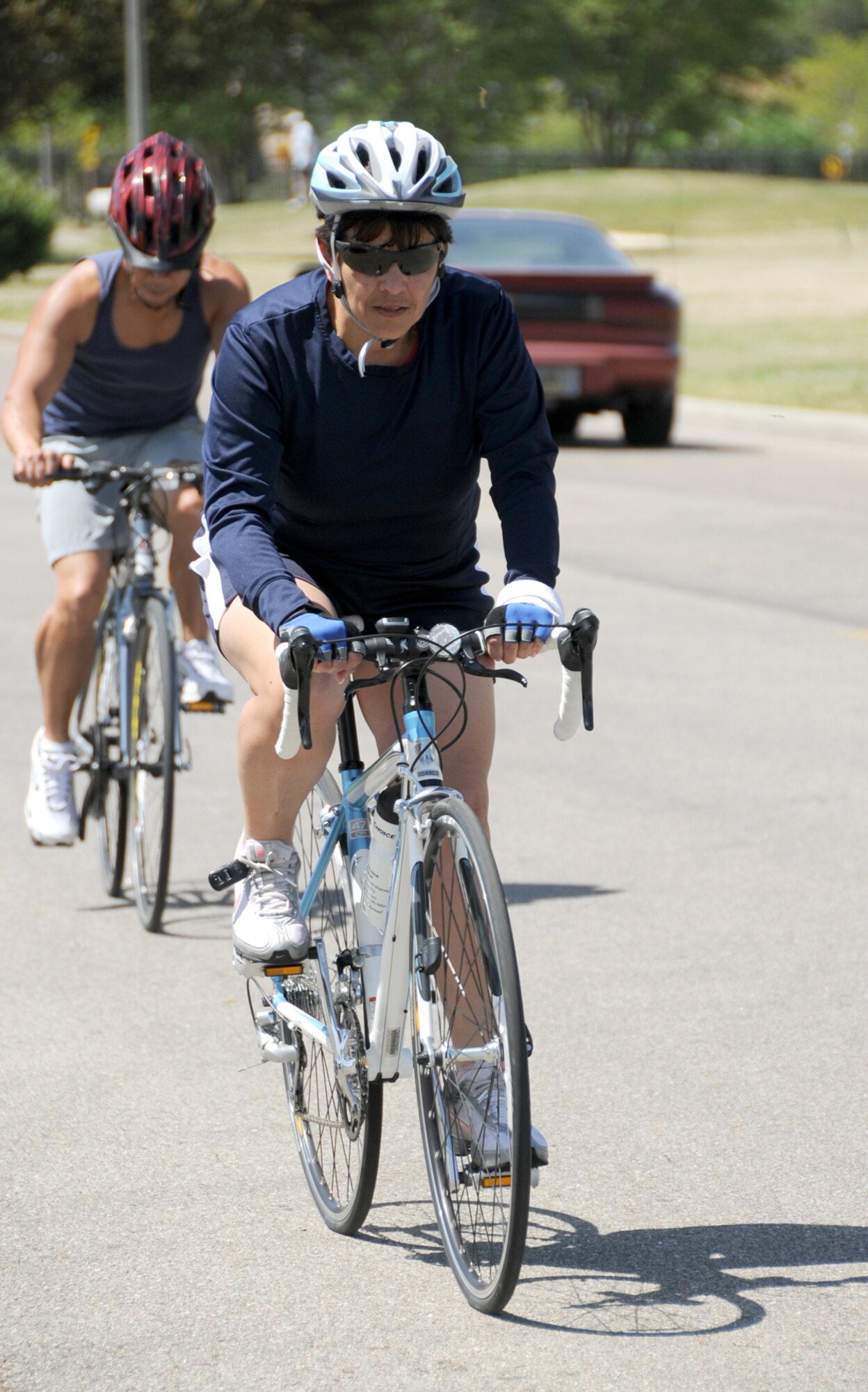 Retired master sergeants Freddie Deang, left, 81st Dental Squadron, and Martha Prieto-Moreno, 81st Medical Group, enjoy recreational bike riding near the Triangle Track April 14.  (U.S. Air Force photo by Kemberly Groue)