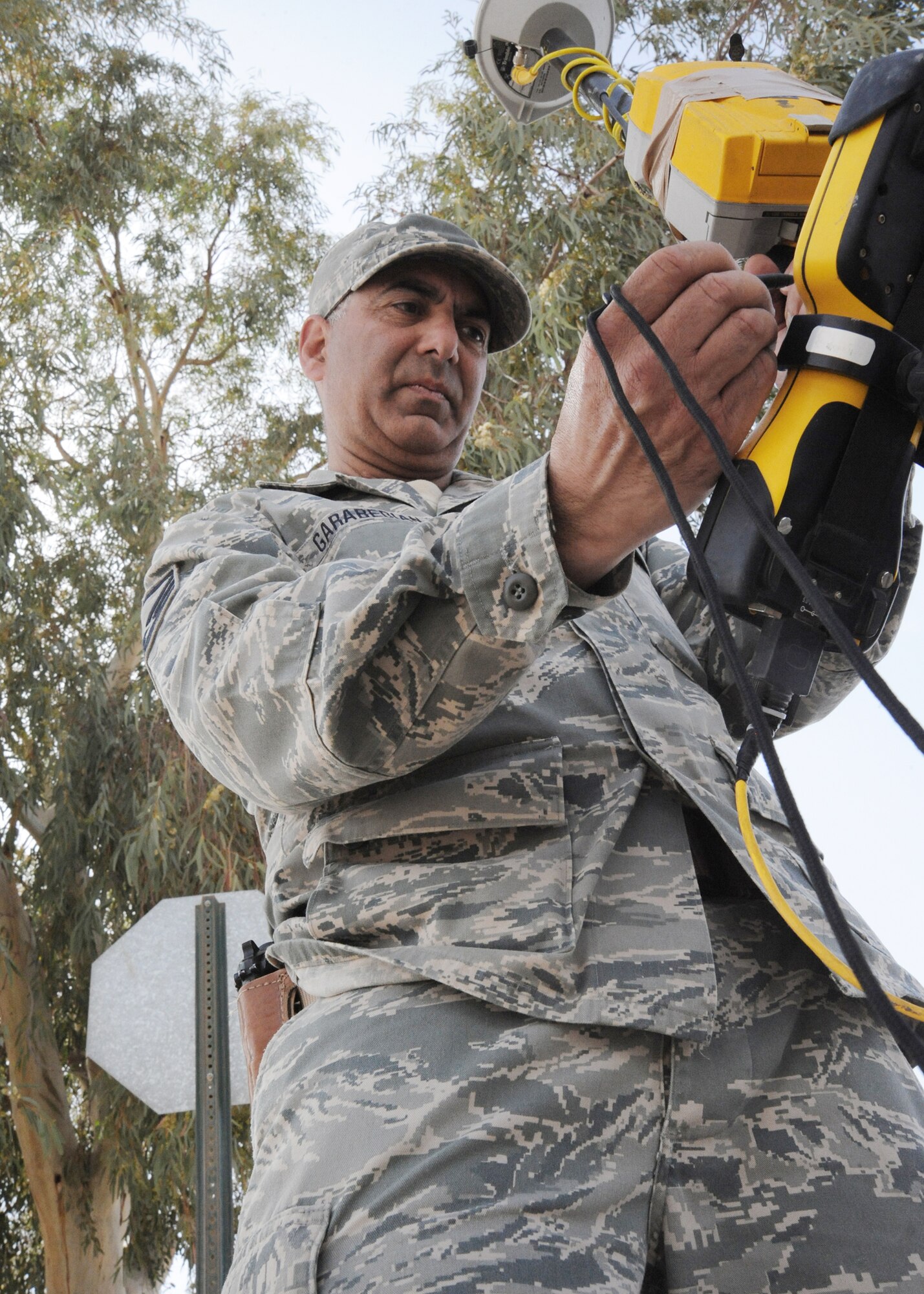 Master Sgt. Varoujan Garabedian inputs data into the global positioning station controller rover April 19, 2010, at Al Asad Air Base, Iraq. Sergeant Garabedian is an engineering assistant for 732nd Expeditionary Prime Beef Squadron. (U.S. Air Force photo/Master Sgt. Trish Bunting)