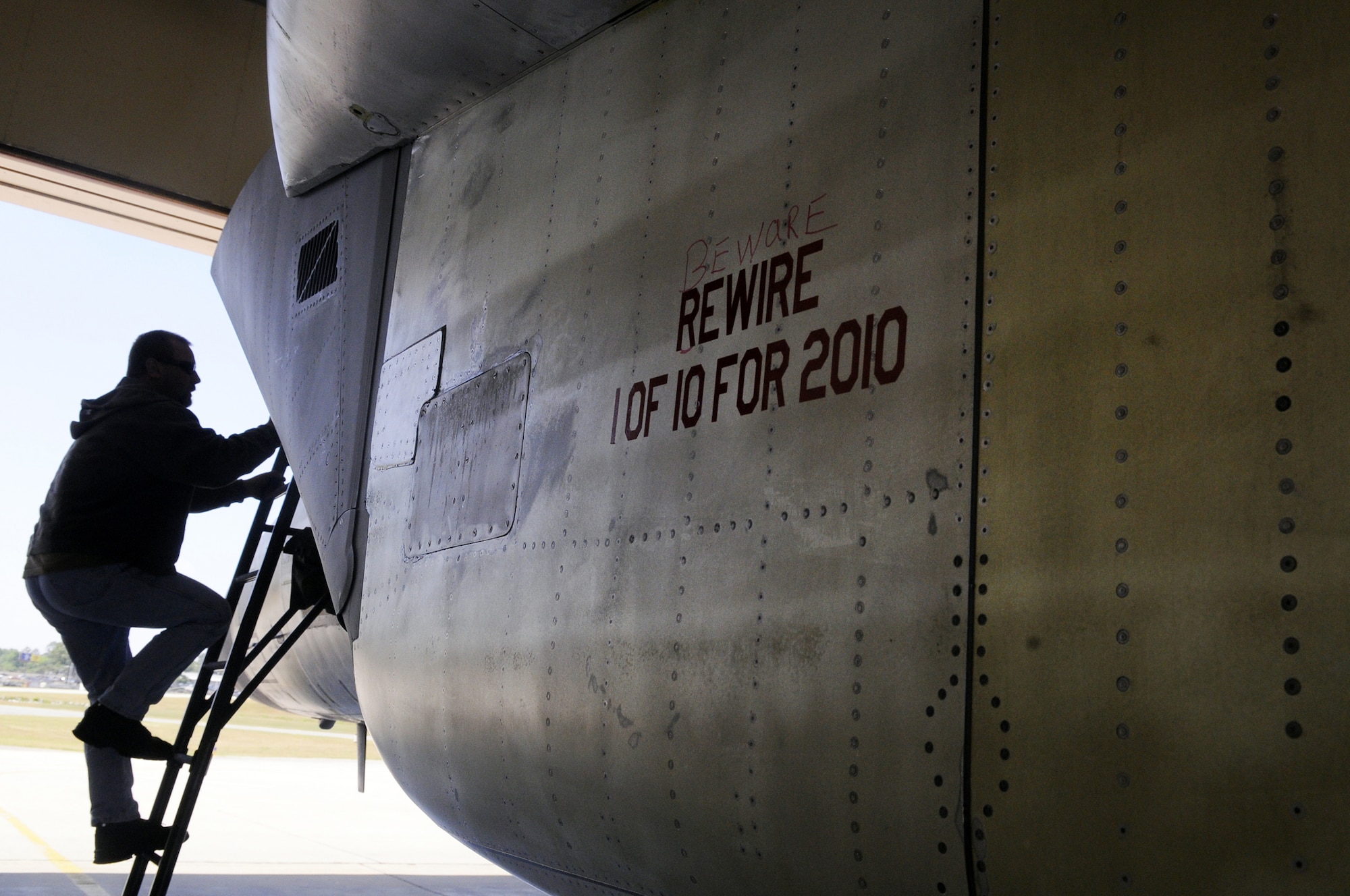 Chuck Hodges, f-15 functional test aircraft technician, climbs into the cockpit of the first rewired F-15 before a test flight April 21. U. S. Air Force photo by Sue Sapp