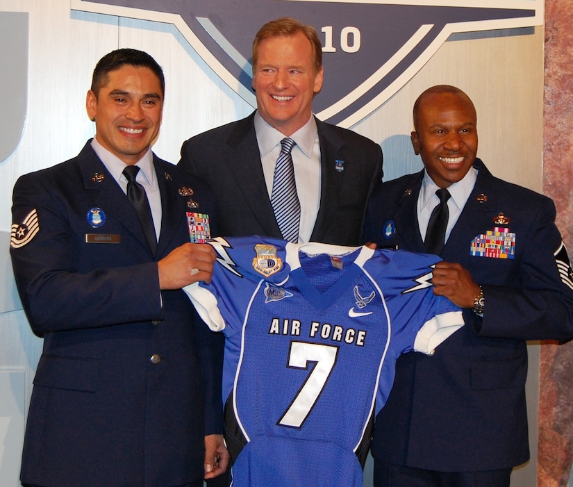 Master Sgt. Tyrone Bingham (right) and Tech. Sgt. Manuel Herrera, two of the
12 Air Force Outstanding Airmen of the Year, present NFL Commissioner Roger
Goodell an Air Force jersey on stage at Radio City Music Hall in New York,
April 22. Bingham and Herrera were special guests of the NFL during the
first day of the 2010 draft. The jersey will hang in a display honoring Army
Ranger Pat Tillman in the NFL headquarters office. The Air Force also
participated in the draft on the second and third days as guests of the NFL,
announcing the 48th draft pick. Over 75 local Airmen were also invited as
audience members. (U.S. Air Force Photo/Capt. Tom Wenz)
