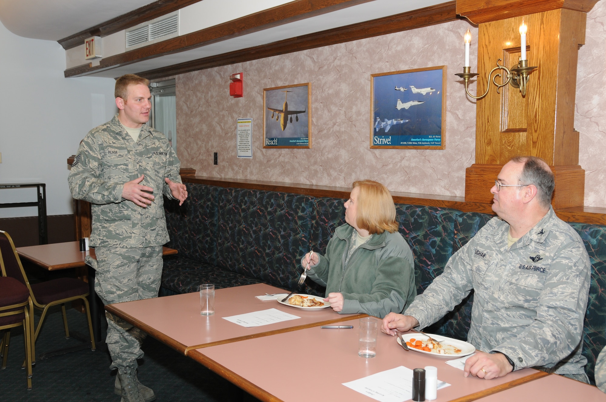 Tech. Sgt. Stephen Pease the dining hall supervisor explains to judges Lt. Col. Linda Blaszak the 107th Force Support Squadron Commander and Col. Timothy Vaughan the 107th Mission Support Group Commander the concept behind the food challenge. "We have done really well in our inspections. These guys have worked cohesively as a team and it is almost a family atmosphere.  At this time what we wanted to do was challenge them. This was a chance to get them to step it up," Sgt. Pease said. (U.S. Air Force photo/Staff Sgt. Peter Dean)