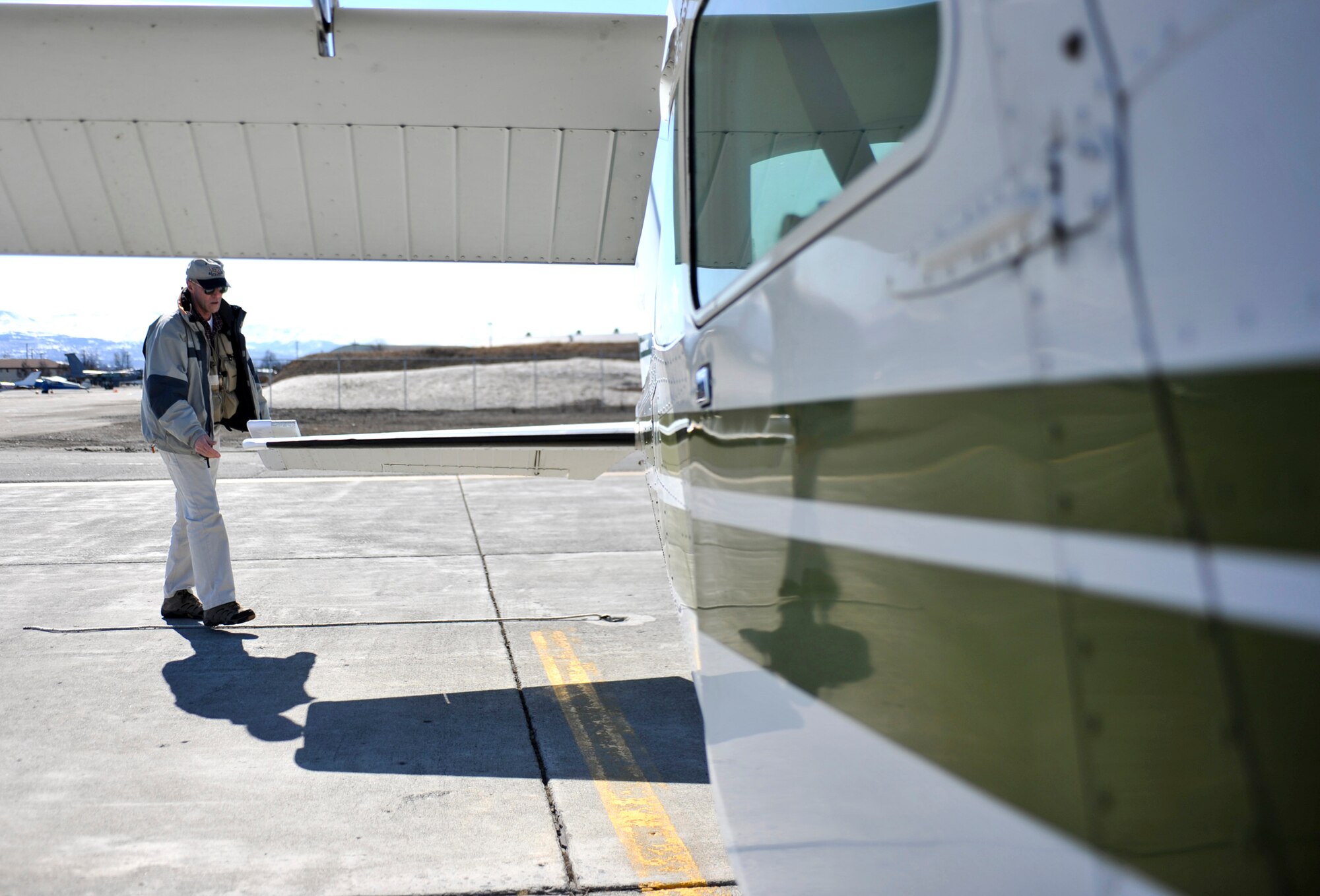ELMENDORF AIR FORCE BASE, Alaska – Wally Hansen, Aero Club assistant chief flight instructor, makes some pre-flight inspections before taking off for a flight April 24. Mr. Hansen is a retired Air Force pilot, and he’s been passing on his flying expertise to those interested in flying with Elmendorf’s Aero Club since 1997. (Air Force photo by Airman 1st Class Christopher Gross)