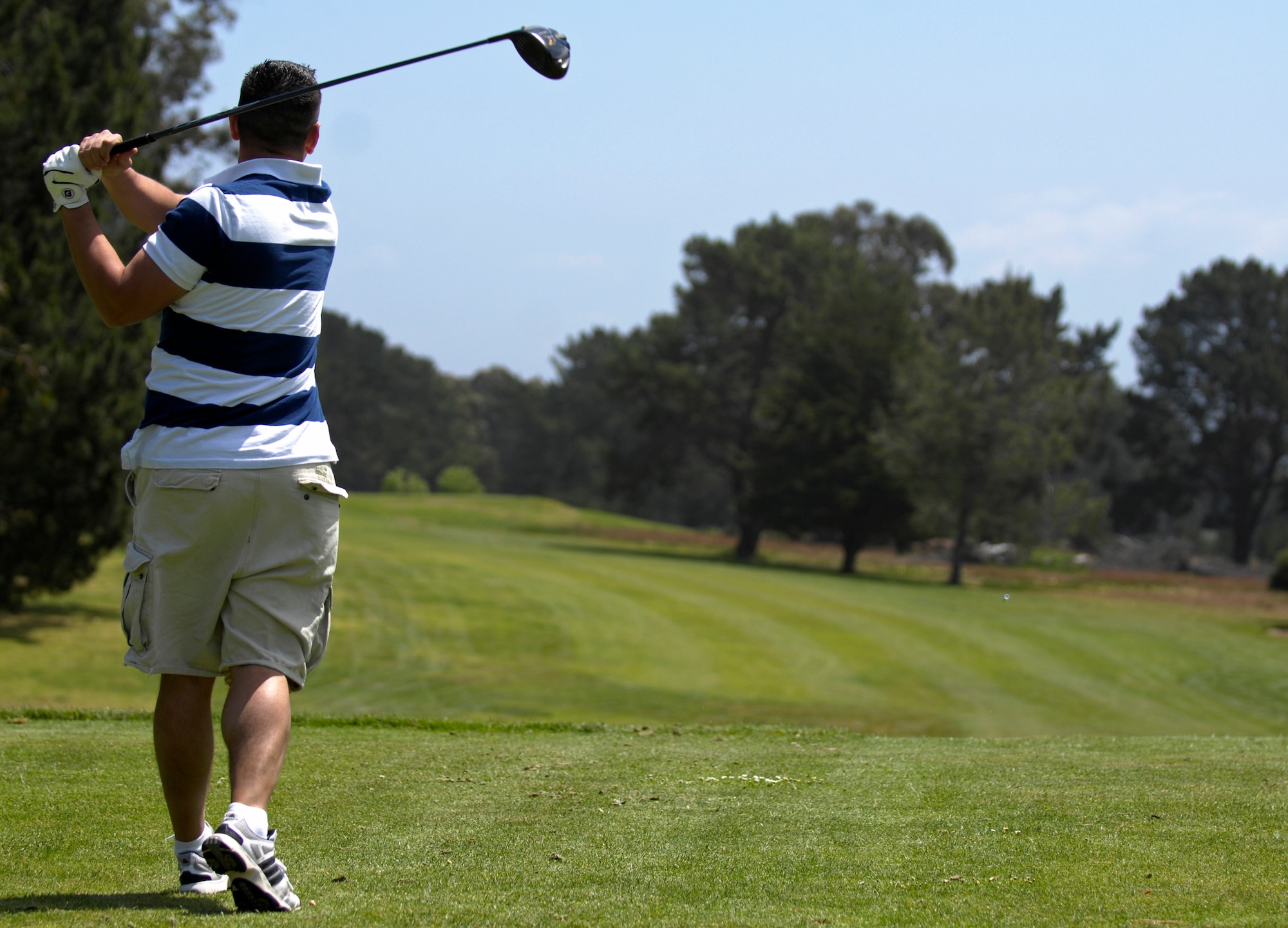 VANDENBERG AIR FORCE BASE, Calif. -- With finesse in his swing, Staff Sgt. Vincent Masters, from the 30th Space Communications Squadron, holds his form and looks in the direction the ball is heading at the Marshallia Ranch Golf Course here Friday, April 23, 2010. (U.S. Air Force photo/Airman 1st Class Andrew Lee) 