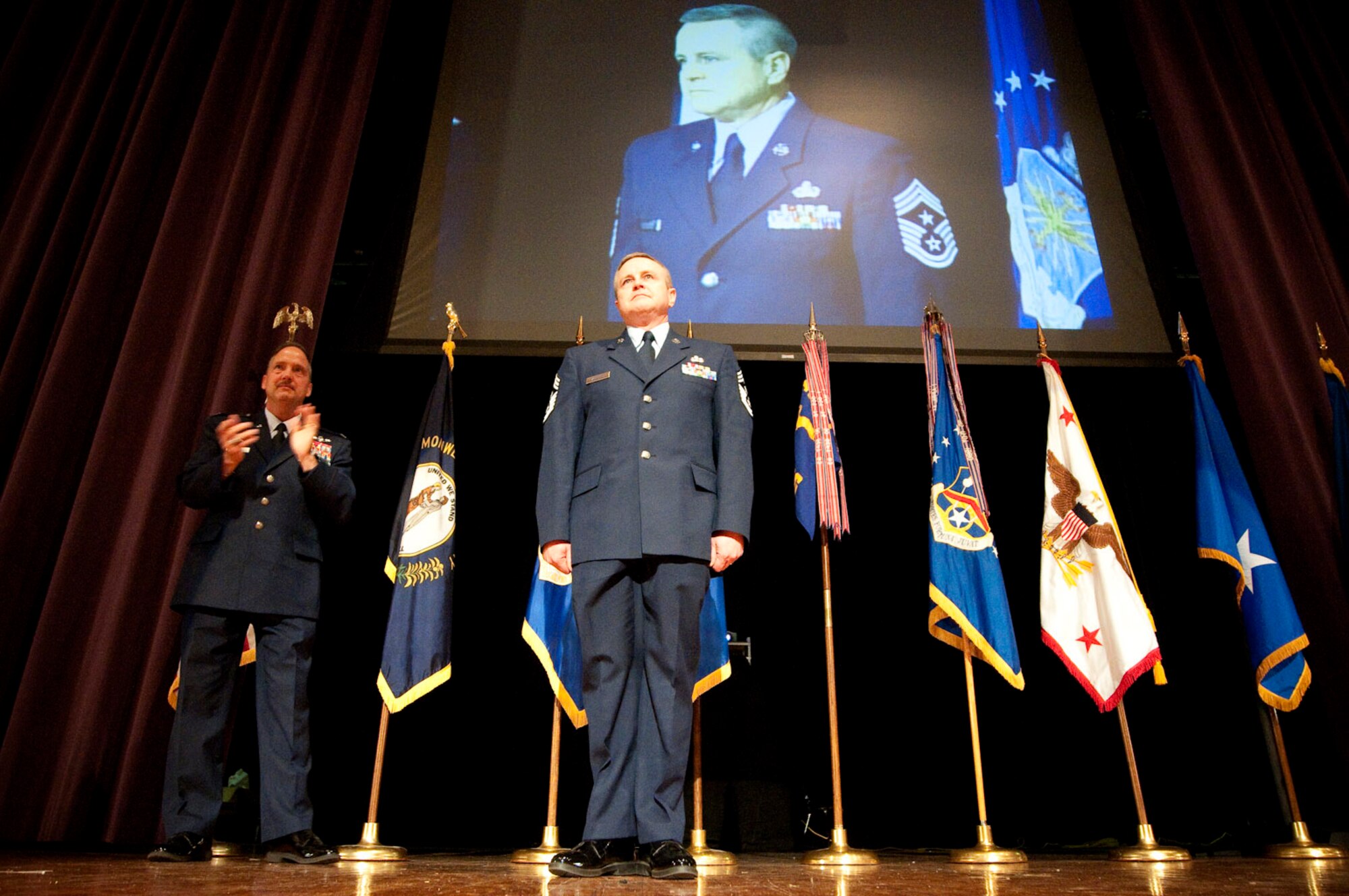 The Kentucky Air Guard welcomed its newest 123rd Airlift Wing command chief master sergeant, Chief Master Sgt. Curtis Carpenter (right), during a change-of-responsibility ceremony held April 17, 2010 at Louisville Male High School in Louisville, Ky. Also pictured is Col. Greg Nelson, commander of the 123rd Airlift Wing. (U.S. Air Force photo/Senior Airman Maxwell Rechel)