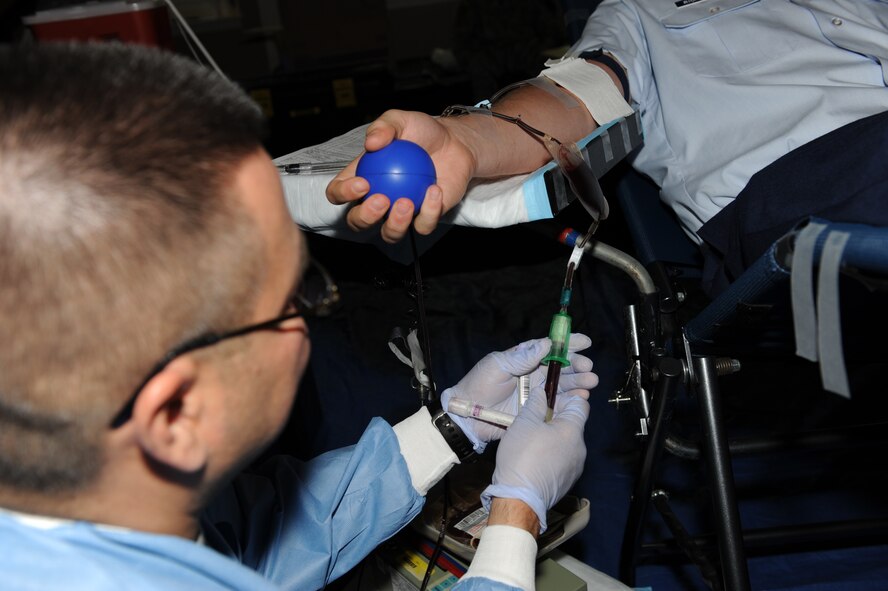 SEYMOUR JOHNSON AIR FORCE BASE, N.C. -- Army Sgt. Jerry Huertay fills a vial of blood here April 26, 2010. Sergeant Huertay is a member of a Fort Bragg medical team that collects blood from donors in support of operations Iraqi and Enduring Freedom. A person can donate blood every eight weeks. Sergeant Huertay, Fort Bragg combat medic, hails from San Antonio. (U.S Air Force photo/Airman 1st Class Gino Reyes)