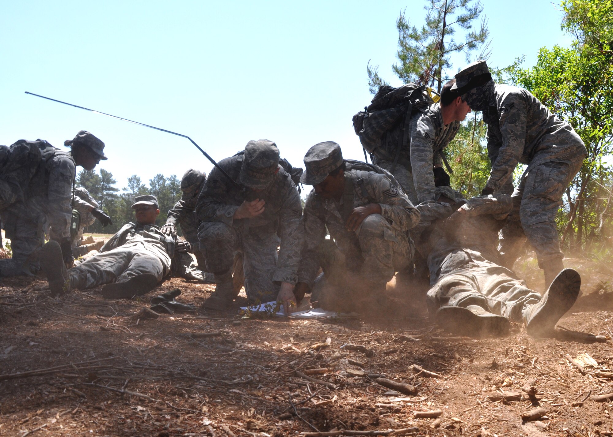EGLIN AIR FORCE BASE, Fla. -- Airmen from the 316th Security Forces Squadron (Andrews AFB, Washington D.C.) recover after encountering their first improvised explosive device during the Counter-IED portion of Brave Defenders training April 22. The team was the first to experience Counter-IED, the newest addition to the training. Brave Defenders is a 16-day program training security forces members from various bases across the country in preparation for deployment to combat zones. The course opened here in 2002 and was established by Air Force Materiel Command to satisfy security forces training requirements in an expeditionary environment.  (U.S. Air Force photo/ Airman 1st Class Anthony Jennings)