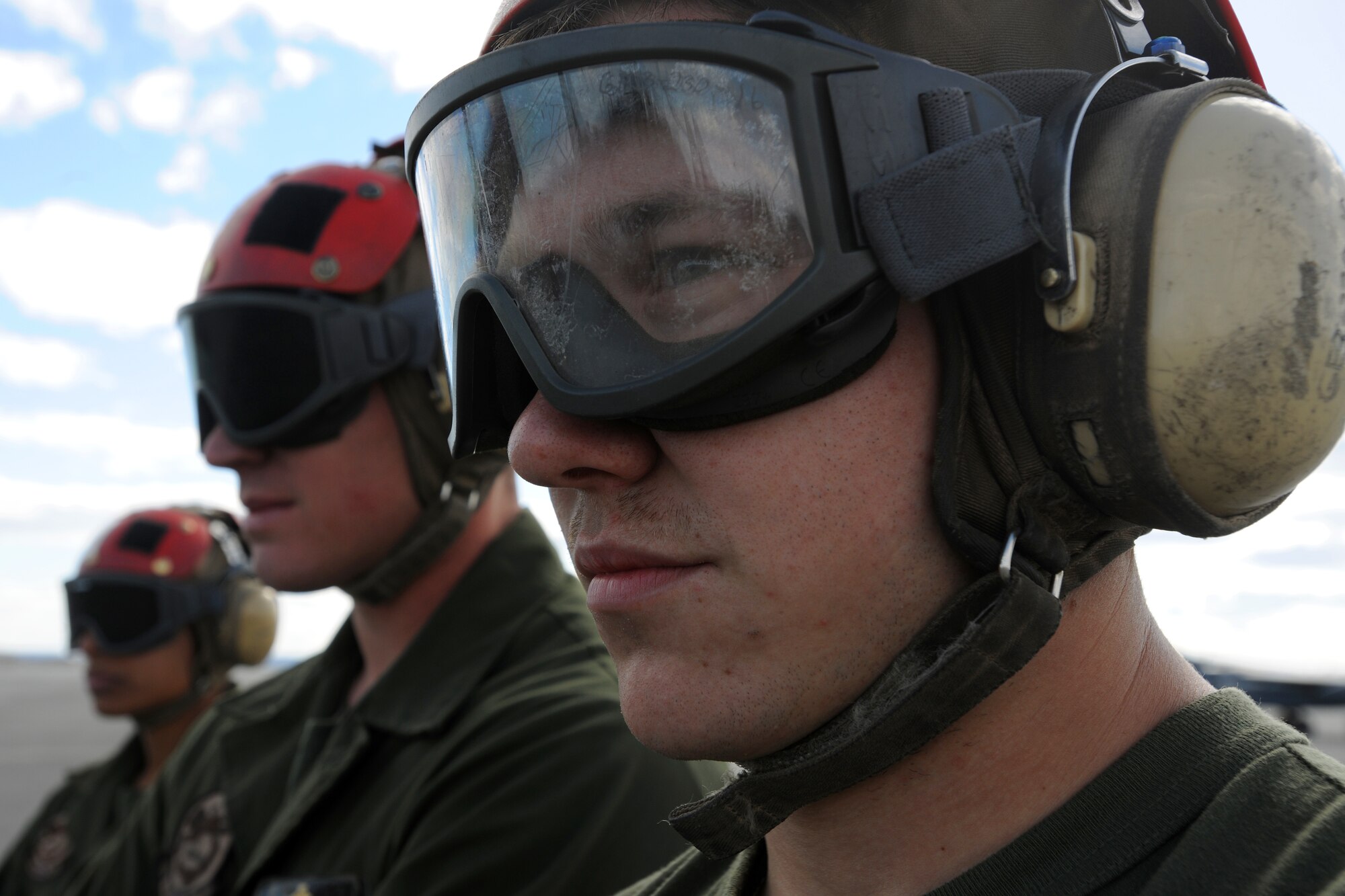 Marine maintainers look on as their AV-8B Harrier jets prepare to launch during RED FLAG-Alaska 10-2, April 27, 2010, Eielson Air Force Base, Alaska.  RF-A is a Pacific Air Forces-directed field training exercise for United States and coalition forces under simulated combat conditions.  The Marine detachment is assigned to VMA-211, Marine Corps Air Station, Yuma, AZ.  (U.S. Air Force photo by Staff Sgt. Tia Wilson)
