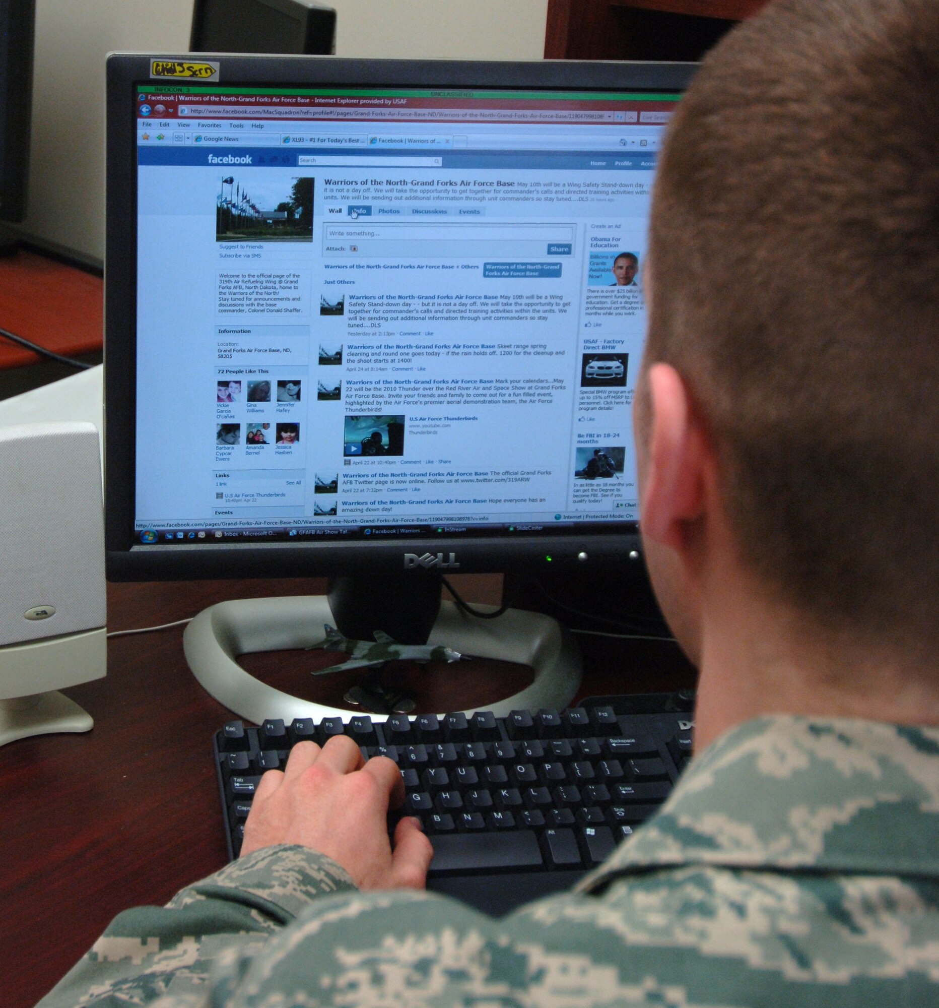 An Airman from the 319th Air Refueling Wing, looks at the "Warriors of the North- Grand Forks Air Force Base" Facebook page after Col. Don Shaffer, 319 ARW commander, and Airmen volunteers, launched the base's first social networking sites on Facebook and Twitter, April 19. (U.S. Air Force photo by Airman 1st Class Rachel Martinez)
