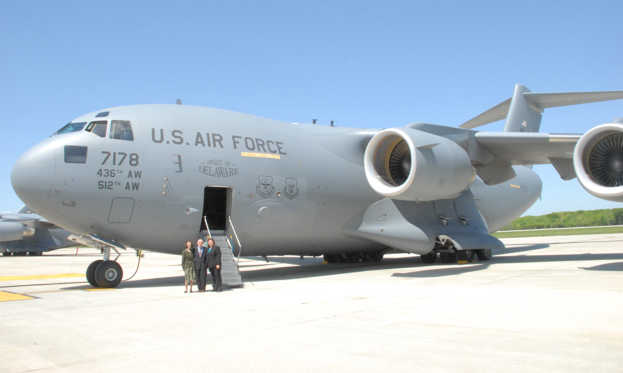 Bettie Campbell, Kevin Smith and Danielle Garbe stand in front of Dover's Spirit of Delaware C-17 Globemaster III during a tour of the isochronal inspection dock, flight line and jet engine shop on April 23. Mr Smith and Ms Campbell are the 2010 honorary commanders of the 436th Maintenance Group. (U.S. Air Force photo / 2nd Lt. Abigail Wise)
