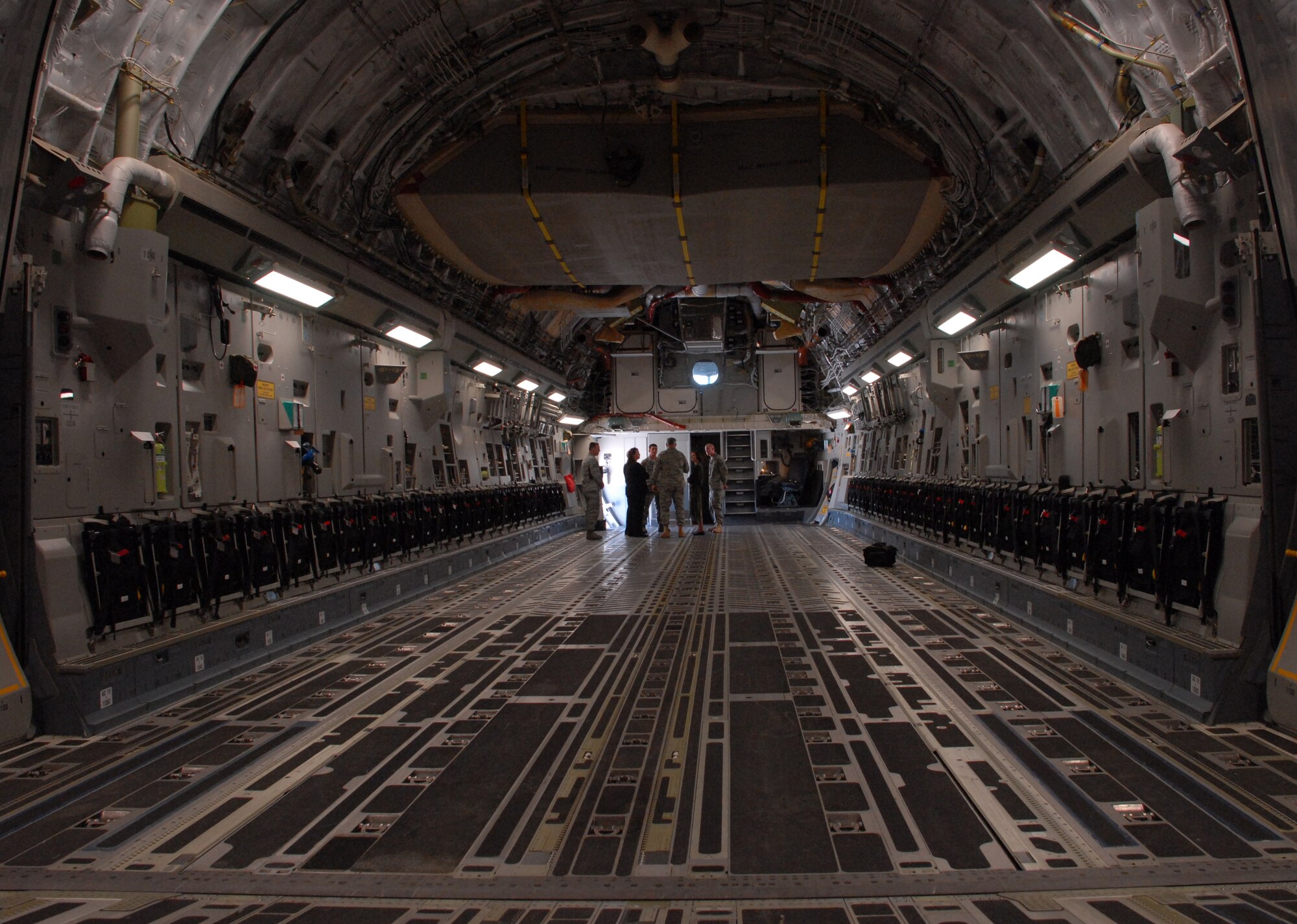 The 436th Maintenance Group honorary commanders for 2010 stand inside Dover's Spirit of Delaware C-17 Globemaster III are the . They received a tour of the isochronal inspection dock, flight line and jet engine shop on April 23. (U.S. Air Force photo / 2nd Lt. Abigail Wise)