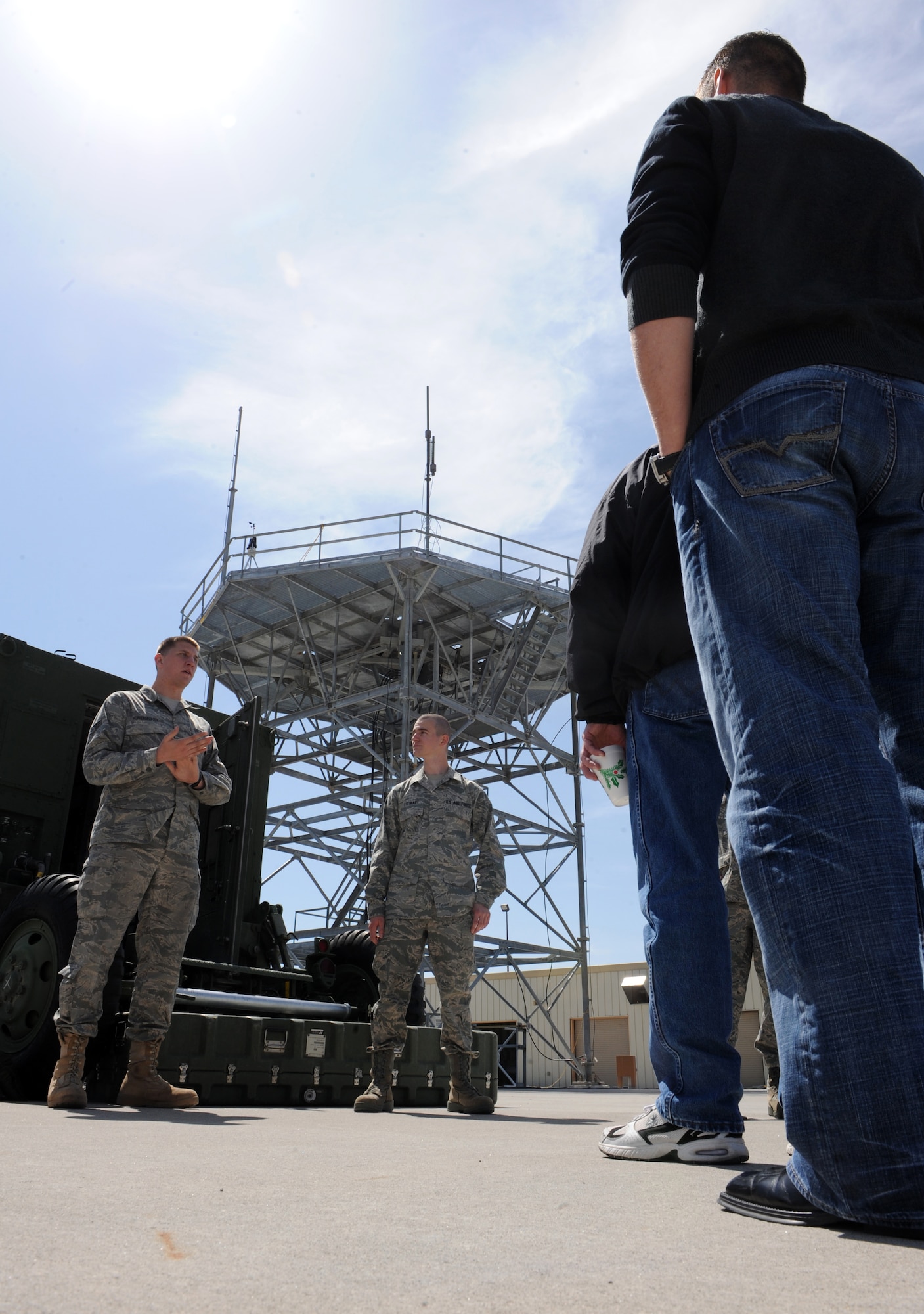 MOUNTAIN HOME AIR FORCE BASE, Idaho – Senior Airman Kyle Hopfensperger and Airman Robert Stewart, both 726th Air Control Squadron digital systems technicians, brief Honorary Commanders on a tour of the unit’s facilities during Operations Group day April 23. The honorary commanders program is a wing-level program that pairs civic leaders with squadron, group and wing leaders to enhance the relationships between local communities and the base. It also provides a rare glimpse of life on a military installation to members of neighboring communities – many of whom have no connection to the Air Force or prior knowledge of the military. (U.S. Air Force photo by Airman 1st Class Debbie Lockhart)