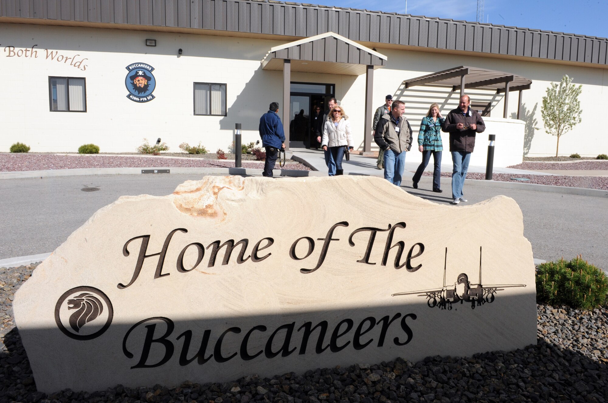 MOUNTAIN HOME AIR FORCE BASE, Idaho -- Members of the Honorary Commander program exit the 428th Fighter Squadron after touring the facility during Operations Group day April 23. The honorary commanders program is a wing-level program that pairs civic leaders with squadron, group and wing leaders to enhance the relationships between local communities and the base. It also provides a rare glimpse of life on a military installation to members of neighboring communities – many of whom have no connection to the Air Force or prior knowledge of the military. (U.S. Air Force photo by Airman 1st Class Debbie Lockhart)
