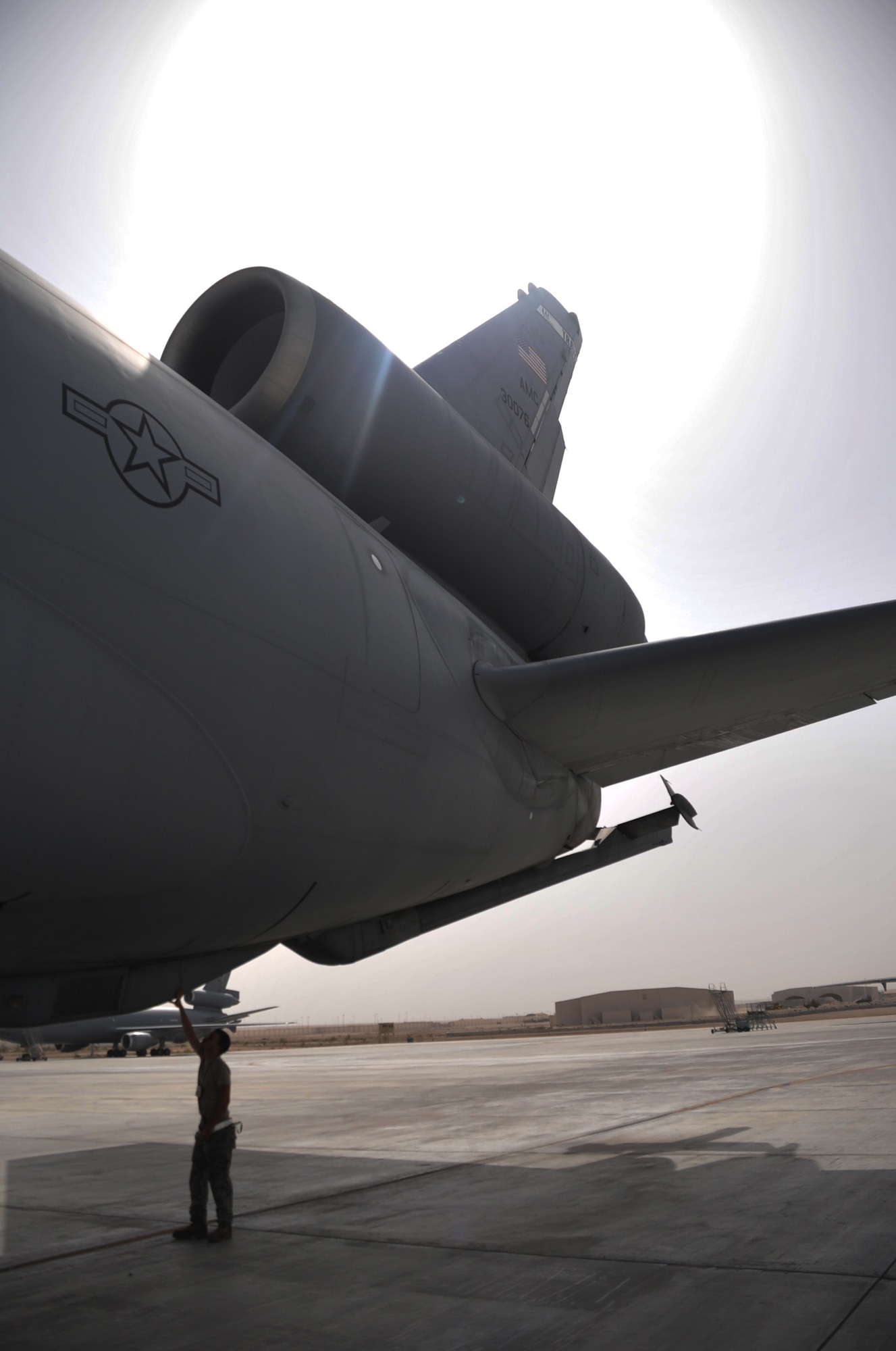 Airman 1st Class Brian Welch, KC-10 Extender crew chief with the 380th Expeditionary Aircraft Maintenance Squadron Extender aircraft maintenance unit, works on a KC-10 during operations for the 380th Air Expeditionary Wing at a non-disclosed base in Southwest Asia on April 24, 2010. Airman Welch is deployed from the 660th Aircraft Maintenance Squadron at Travis Air Force Base, Calif. (U.S. Air Force Photo/Master Sgt. Scott T. Sturkol/Released)