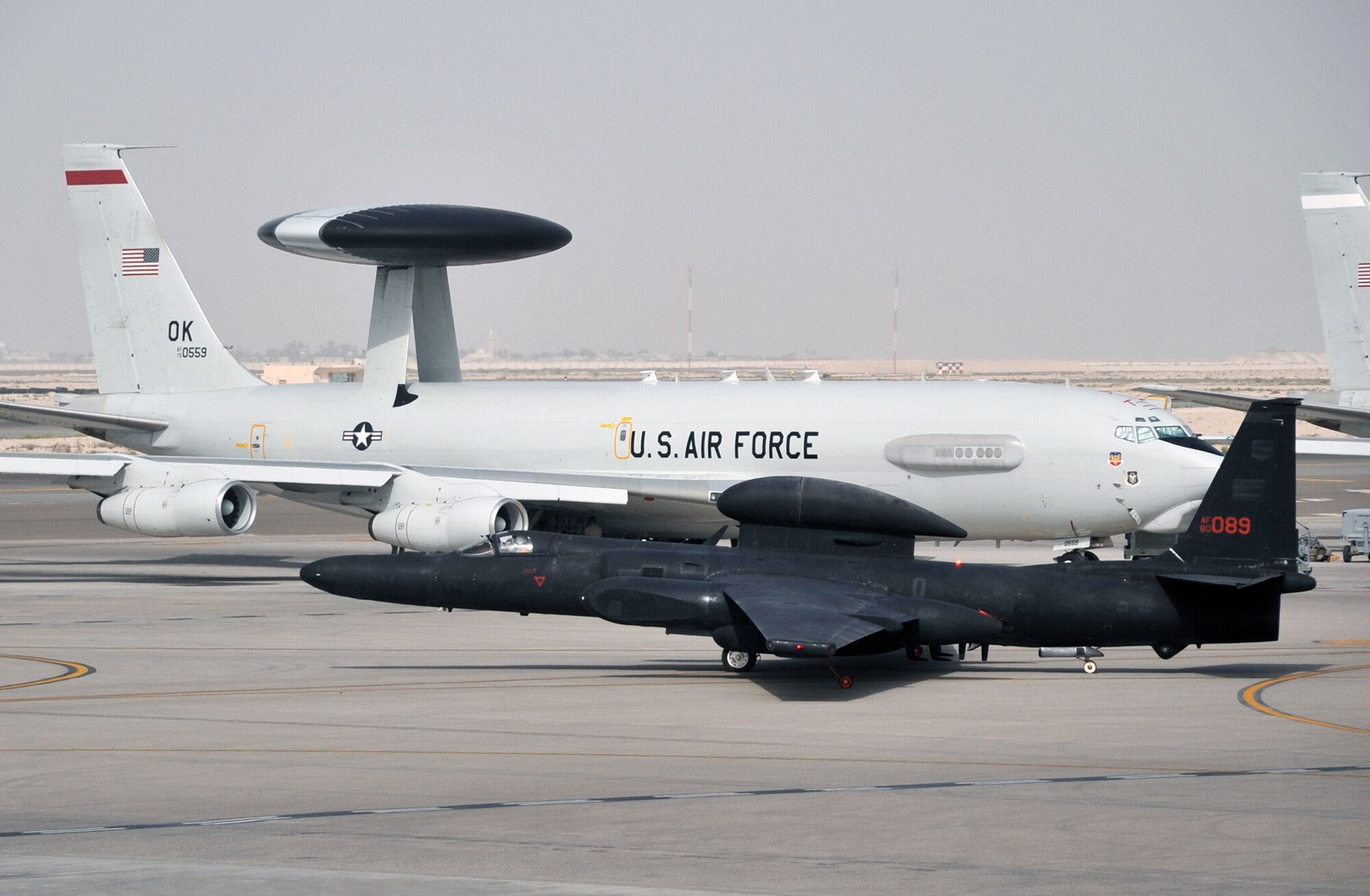 A pilot guides a U-2 Dragon Lady across the air field in front of deployed E-3 Sentry Airborne Warning and Control System aircraft April 24, 2010, en route to a mission in support of operations in the U.S. Central Command area of responsibility from a non-disclosed base in Southwest Asia. The pilot and the U-2 are with the 99th Expeditionary Reconnaissance Squadron and the E-3 Setrys are with the 965th Expeditionary Airborne Air Control Squadron, both units of the 380th Air Expeditionary Wing.  Through the first three months of 2010, U-2s from the 99th ERS flew nearly 200 missions in support of intelligence, surveillance and reconnaissance requirements for deployed forces supporting operations Iraqi Freedom and Enduring Freedom and the Combined Joint Task Force-Horn of Africa. (U.S. Air Force Photo/Master Sgt. Scott T. Sturkol/Released)