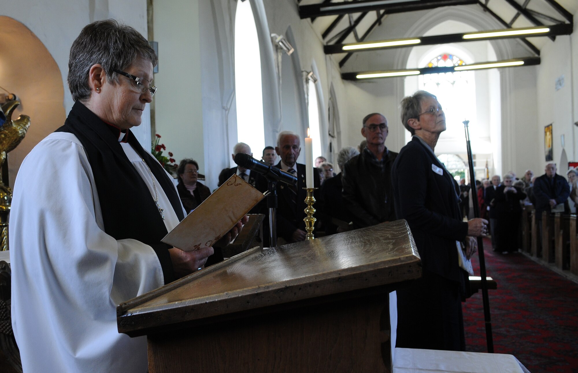 Kessingland, England -- Rev. Canon Lyndy Domoney, Rector of Kessingland, concludes the indoor segment of a memorial service at the St. Edmund's Church in Kessingland April 22. Twelve U.S. Air Force servicemembers were remembered in a memorial service April 22 to mark the 66th anniversary of the B24 Liberator 843 Repulser being downed by Axis fighter pilots. Rt. Rev. Graham James, Bishop of Norwich, officiated the service. (U.S. Air Force photo/Staff Sgt. Thomas Trower)