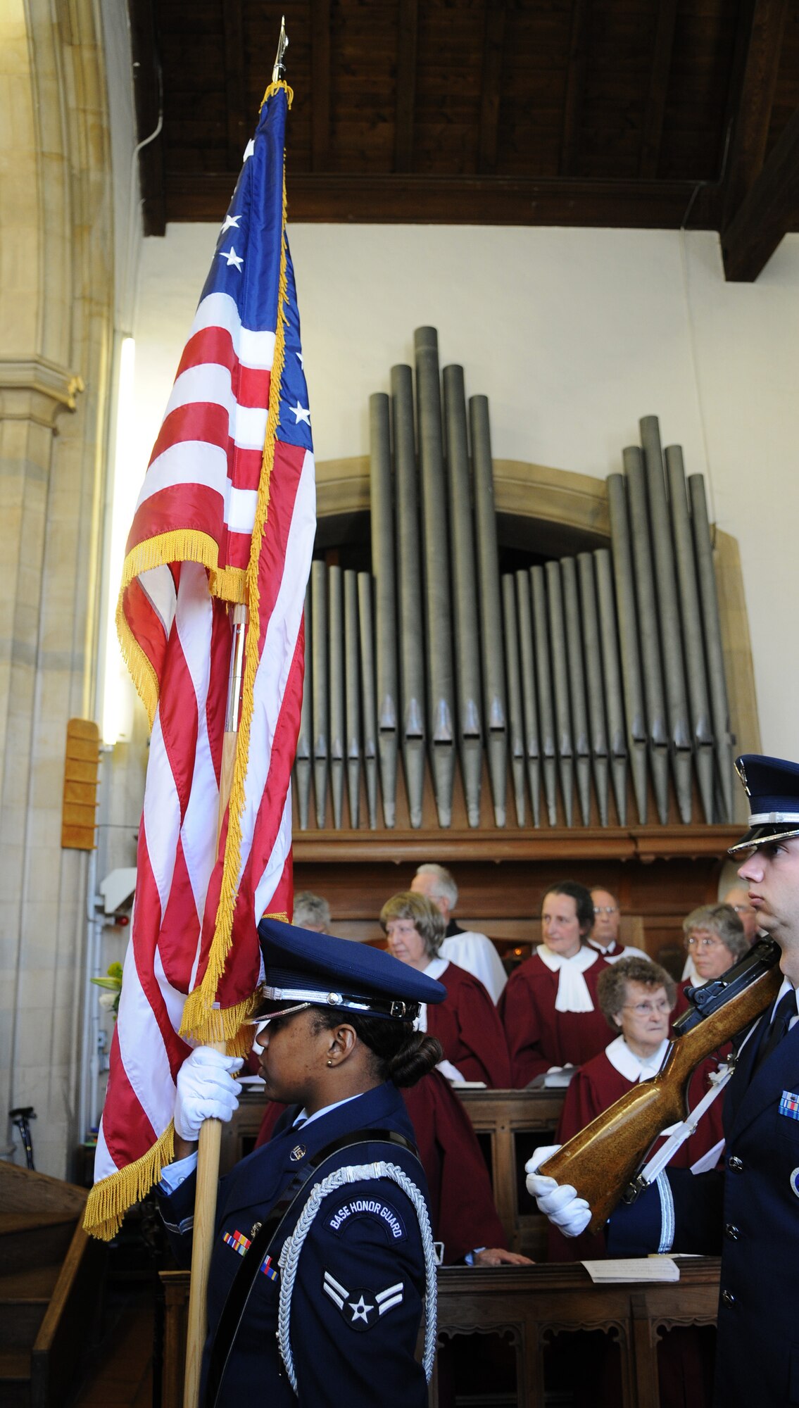 Kessingland, England -- RAF Mildenhall honor guardsmen present the colors at a memorial service for 12 crew members of B24 Liberator 843 Repulser, which was shot down 66 years ago. Relatives of the servicemembers who died in the crash had planned to attend, however grounded flights prevented all but one from arriving. (U.S. Air Force photo/Staff Sgt. Thomas Trower) 