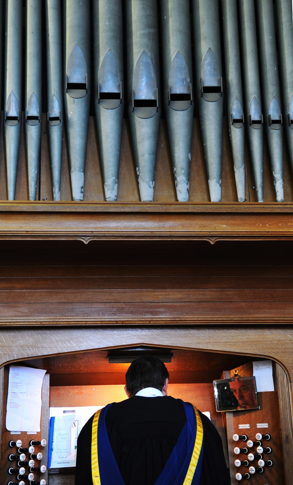 Kessingland, England -- An organist at the St. Edmund's Church in Kessingland plays before a memorial service April 22. Twelve crew members of B24 Liberator 843 Repulser, which was shot down 66 years ago, were remembered at the village's war memorial in the grounds of the church during the service held by Rt. Rev. Graham James, Bishop of Norwich. The U.S. Air Force crew was returning from a bombing run over Hamm, Germany, when they were attacked by Axis fighter aircraft. (U.S. Air Force photo/Staff Sgt. Thomas Trower) 