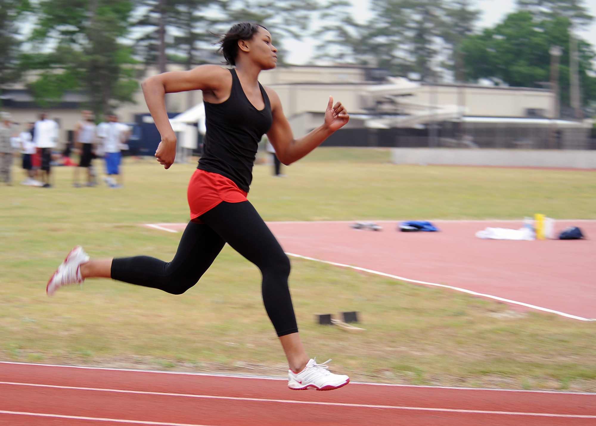 SEYMOUR JOHNSON AIR FORCE BASE, N.C. -- Airman 1st Class Shamika France strides toward the finish line during the 400-meter race here, April 23, 2010. The 400-meter race is one complete lap around a quarter-mile track. France finished in third place with a time of 1 minute, 14 seconds. During the track meet those who came in 1st, 2nd, 3rd or 4th place received a ribbon. Airman France is from Charleston, S.C. (U.S. Air Force photo/Senior Airman Whitney Lambert)