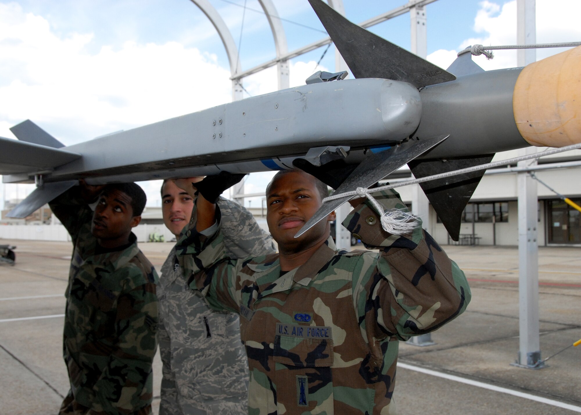 Congratulations to Senior Airman Jaltheus Mannery, Staff Sgt. Michael Chavarria and Senior Airman Damon Bryant, 46th Aircraft Maintenance Squadron, on being selected as the Weapons Load Crew of the Year for the wing.  (U.S. Air Force photo/Samuel King Jr.)