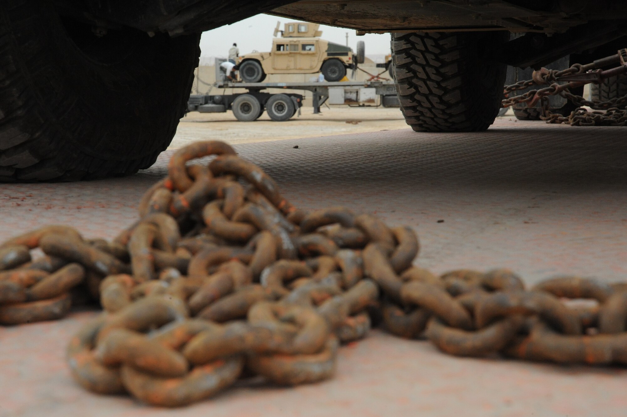 A humvee is secured by several drivers before they leave the Redistribution Property Assistance Team yard whose final destination is Arifjan, Kuwait, as part of the drawdown, Al Asad Air Base, Iraq, April 17, 2010. The mission of the RPAT is to meet the presidential intent to facilitate the expedient turn-in of all excess Class VII Theater Provided Equipment, improve property accountability of retrograding equipment from Iraq and enable asset visibility of the received equipment during transit to Source of Repair or Operation Enduring Freedom.(U.S. Air Force photo/Master Sgt. Trish Bunting/Released)