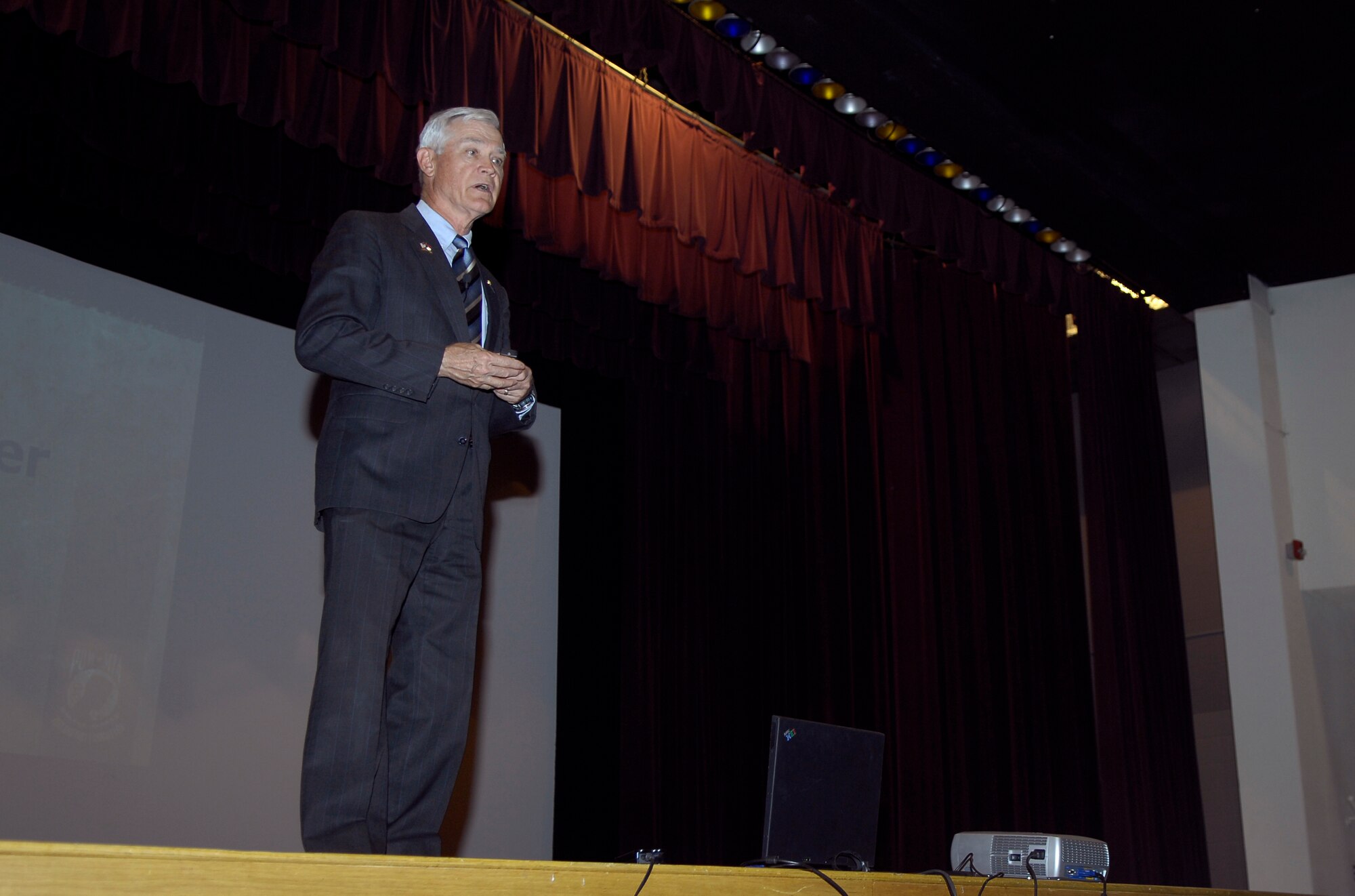 MINOT AIR FORCE BASE, N.D. -- Retired Lt. Col. Barry Bridger talks with Minot Airmen about his experiences as a six-year prisoner of war during the Vietnam War at the base theater here April 23. On Jan. 23, 1967, Colonel Bridger was shot down over Son Tay, North Vietnam, by a surface-to-air missile and subsequently captured and tortured for six years. He escaped to complete a fruitful career and retire after 22 years of service. He now travels the nation teaching today’s Airmen about the monumentous sacrifice POWs and servicemembers missing in action make for the freedom of all Americans. (U.S. Air Force photo by Senior Airman Benjamin Stratton)