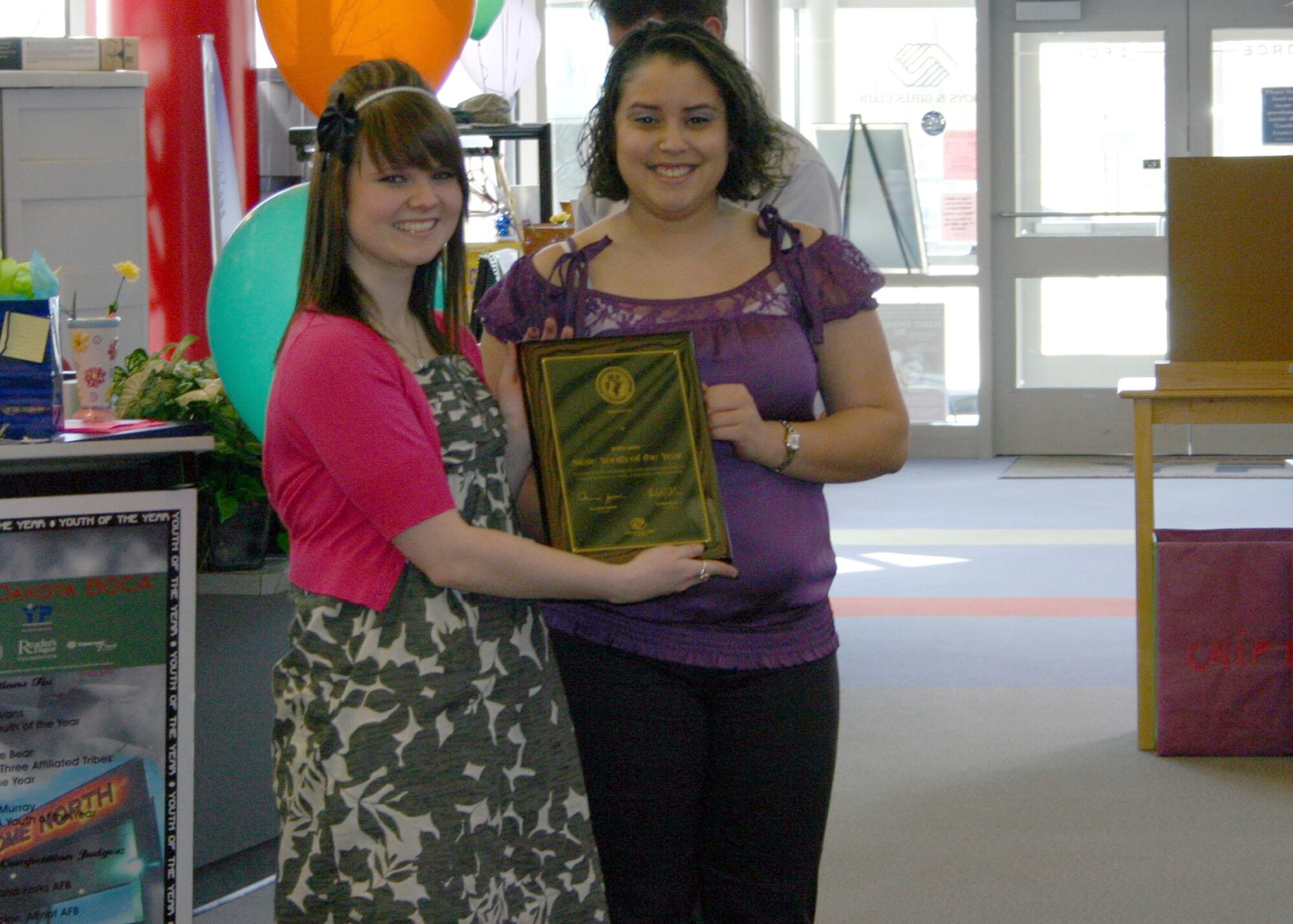 MINOT AIR FORCE BASE, N.D. – Tara Evans, daughter of Master Sgt. Paul Evans, currently assigned to Kunsan AB, Korea, poses for a picture with Vanessa Cruz, a competition judge from Grand Forks AFB, after receiving her 2010 North Dakota Youth of the Year award at the David C. Jones Youth Center here April 10.  This year’s contestants were graded in three separate areas to determine the winner.  Tara now has an opportunity to compete in the regional competition held in Chicago, Ill. (Courtesy photo)
