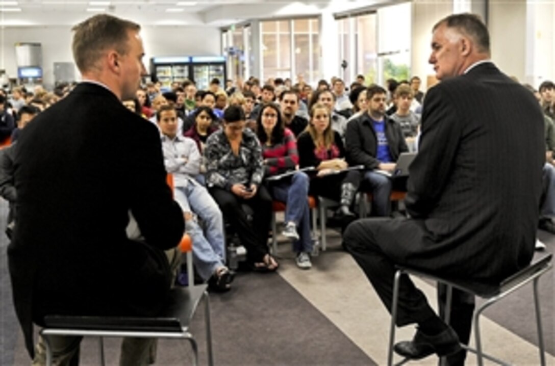 Deputy Defense Secretary William J. Lynn III and former U.S. Marine Don Faul, director of online operations for Facebook, talk to Facebook website workers in Silicon Valley, Calif., April 28, 2010. 