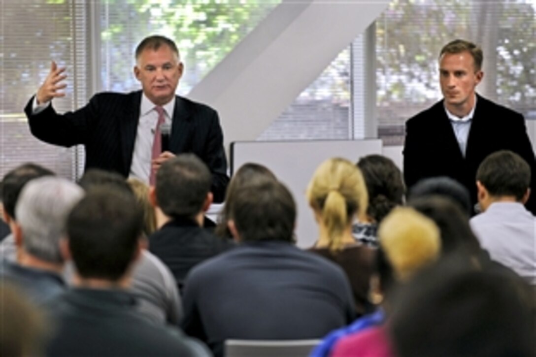 Deputy Defense Secretary William J. Lynn III and former U.S. Marine Don Faul, director of online operations for Facebook, talk to Facebook website workers in Silicon Valley, Calif., April 28, 2010. 