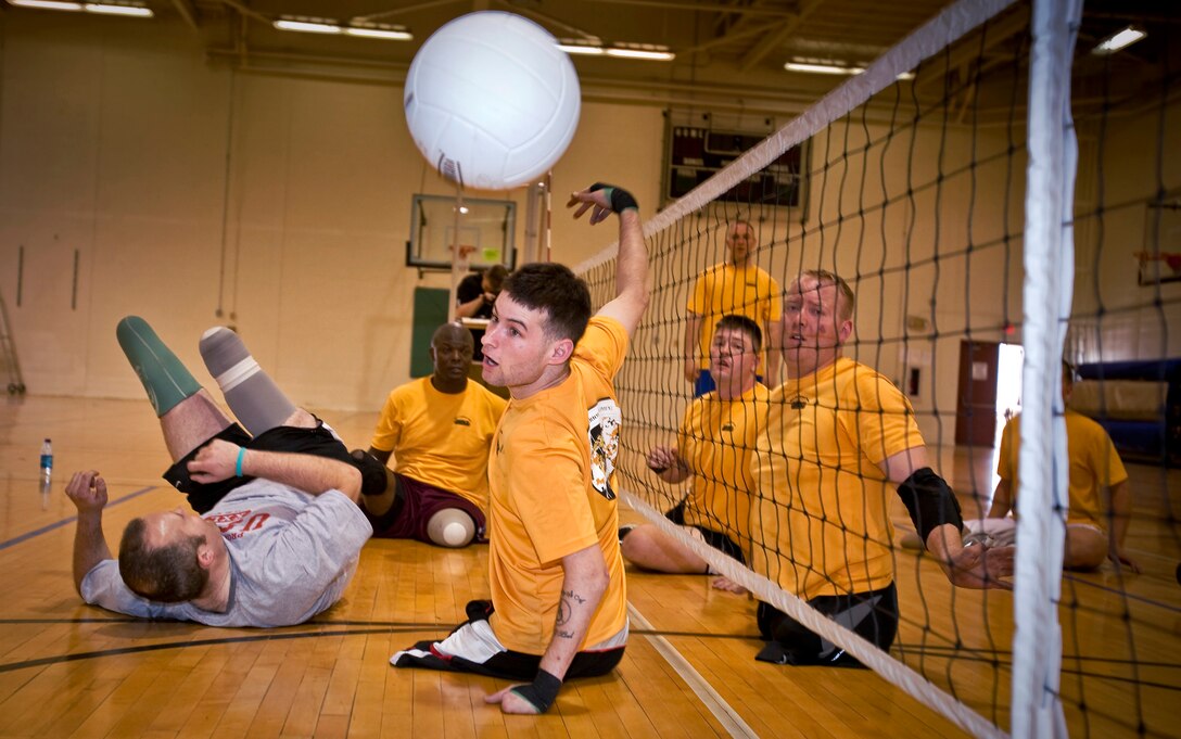 All-Marine Warrior Games Team Athlete Ray Hennagir (center) loses control of a ball during a sitting volleyball scrimmage, Apr. 28. All-Marine athletes practice in various events during the two-week Warrior Games training camp leading up to the inaugural Warrior Games May 10 - 14, at the U.S. Olympic Training Center.