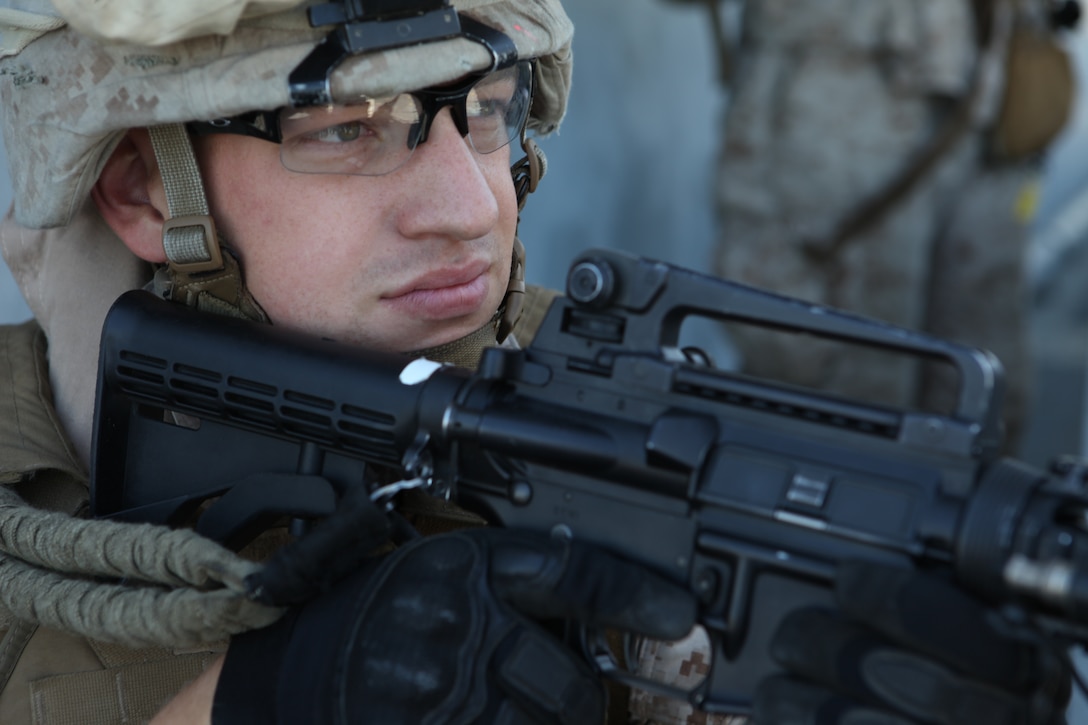 A Marine with Battalion Landing Team 3/8, 26th Marine Expeditionary Unit, provides security during a Visit, Board, Search, and Seizure (VBSS) exercise aboard SS Cape Ann on the James River near Fort Eustis, Va., April 29, 2010. 26th MEU is embarked aboard USS Kearsarge, USS Carter Hall, and USS New York for Amphibious Squadron (PHIBRON)/ Marine Expeditionary Unit Integration (PMINT) training. PMINT integrates 26th MEU Marines with their Navy counterparts to train in the planning and execution of missions they could conduct when they deploy together this fall. ::r::::n::::r::::n::