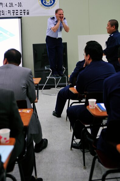 Lt. Col. Michael Heuer, Headquarters Air Force Intelligence, Surveillance and Reconnaissance Agency staff chaplain at Lackland Air Force Base, Texas, conducts a suicide intervention scenario with a group of Republic of Korea Air Force chaplains during Applied Suicide Intervention Skills Training April 27, 2010. (U.S. Air Force photo/Staff Sgt. Eunique Stevens) 
