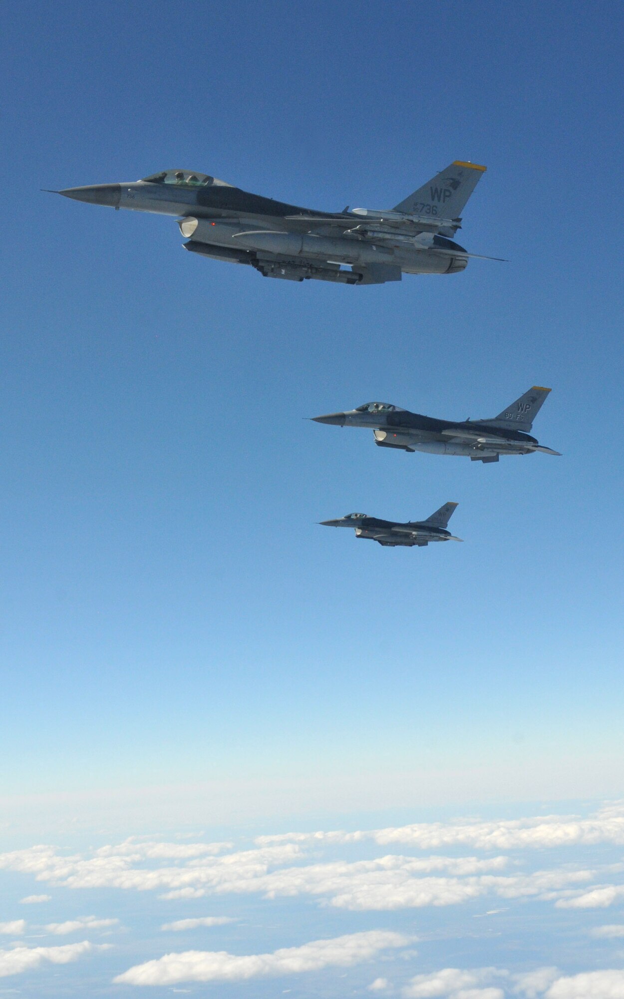 Three F-16 Fighting Falcons pilots with the 8th Fighter Wing's 80th Fighter Squadron, Kunsan Air Base, Republic of Korea, maintain their position as they wait for the last of their four-ship to refuel from a KC-135 Stratotanker from Fairchild Air Force Base, Wash., during Red Flag-Alaska April 27. Red Flag-Alaska is a 10-day field training exercise that provides joint offensive counter-air, interdiction, close air support and large force employment training in a simulated combat environment. (U.S. Air Force photo/Capt. Shannon Collins)