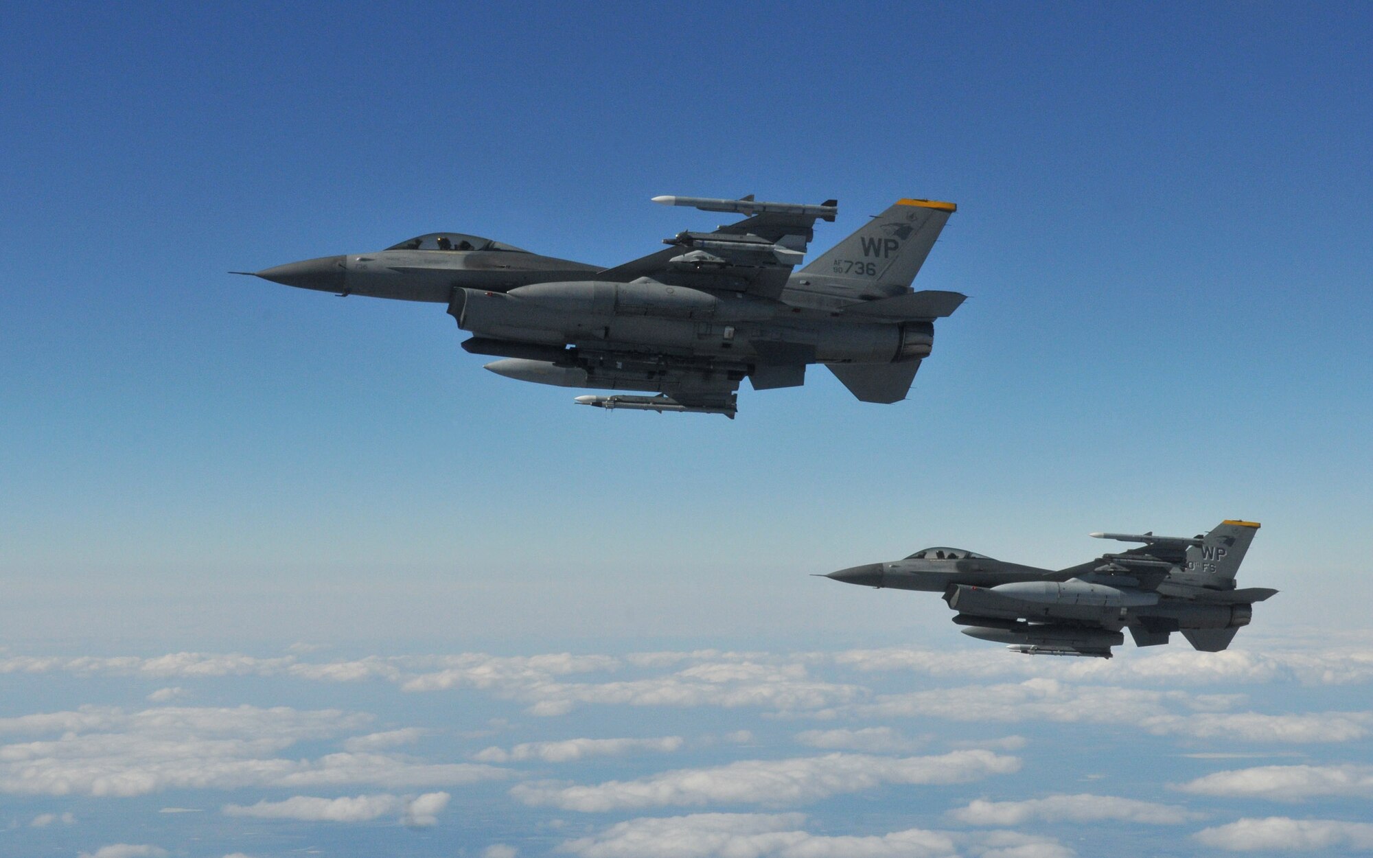Two F-16 Fighting Falcons pilots with the 8th Fighter Wing's 80th Fighter Squadron, Kunsan Air Base, Republic of Korea, maintain their position as they wait for the rest of their four-ship to refuel from a KC-135 Stratotanker from Fairchild Air Force Base, Wash., during Red Flag-Alaska April 27. Red Flag-Alaska is a 10-day air combat training exercise that provides joint offensive counter-air, interdiction, close air support and large force employment training in a simulated combat environment. (U.S. Air Force photo/Capt. Shannon Collins)