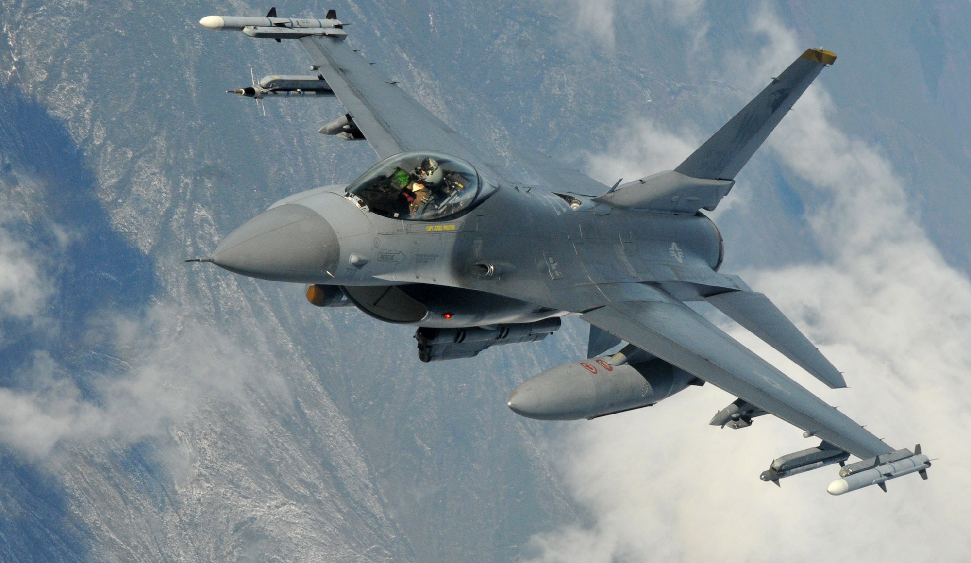 Capt. George "Frag" Collings, an F-16 Fighting Falcon from the 8th Fighter Wing's 80th Fighter Squadron Headhunters, Kunsan Air Base, Republic of Korea, visually confirms as he rolls away after refueling from a KC-135 Stratotanker from Fairchild Air Force Base, Wash., during Red Flag-Alaska April 27. Red Flag-Alaska is a 10-day field training exercise that provides joint offensive counter-air, interdiction, close air support and large force employment training in a simulated combat environment. (U.S. Air Force photo/Capt. Shannon Collins)